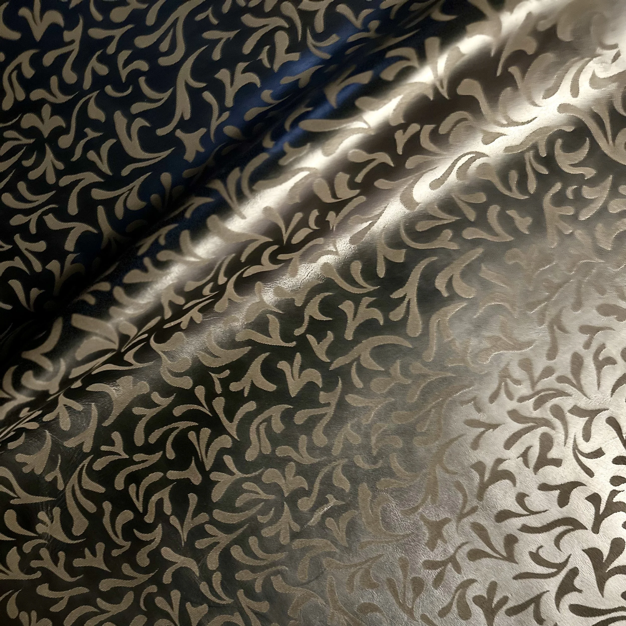 engraved on Maude leather in color clove