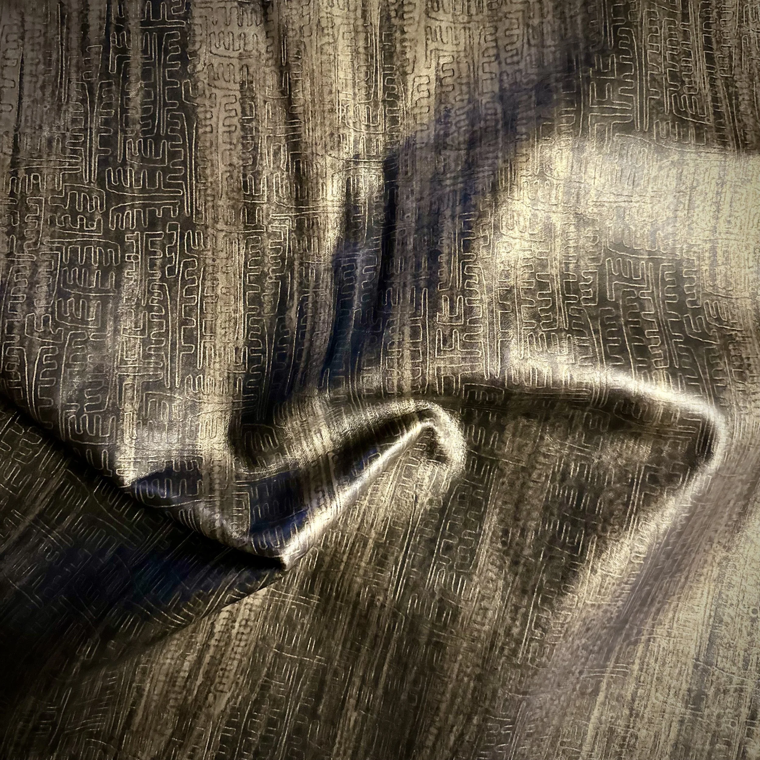 custom etched on Maude leather in licorice with bronze Andromeda finish