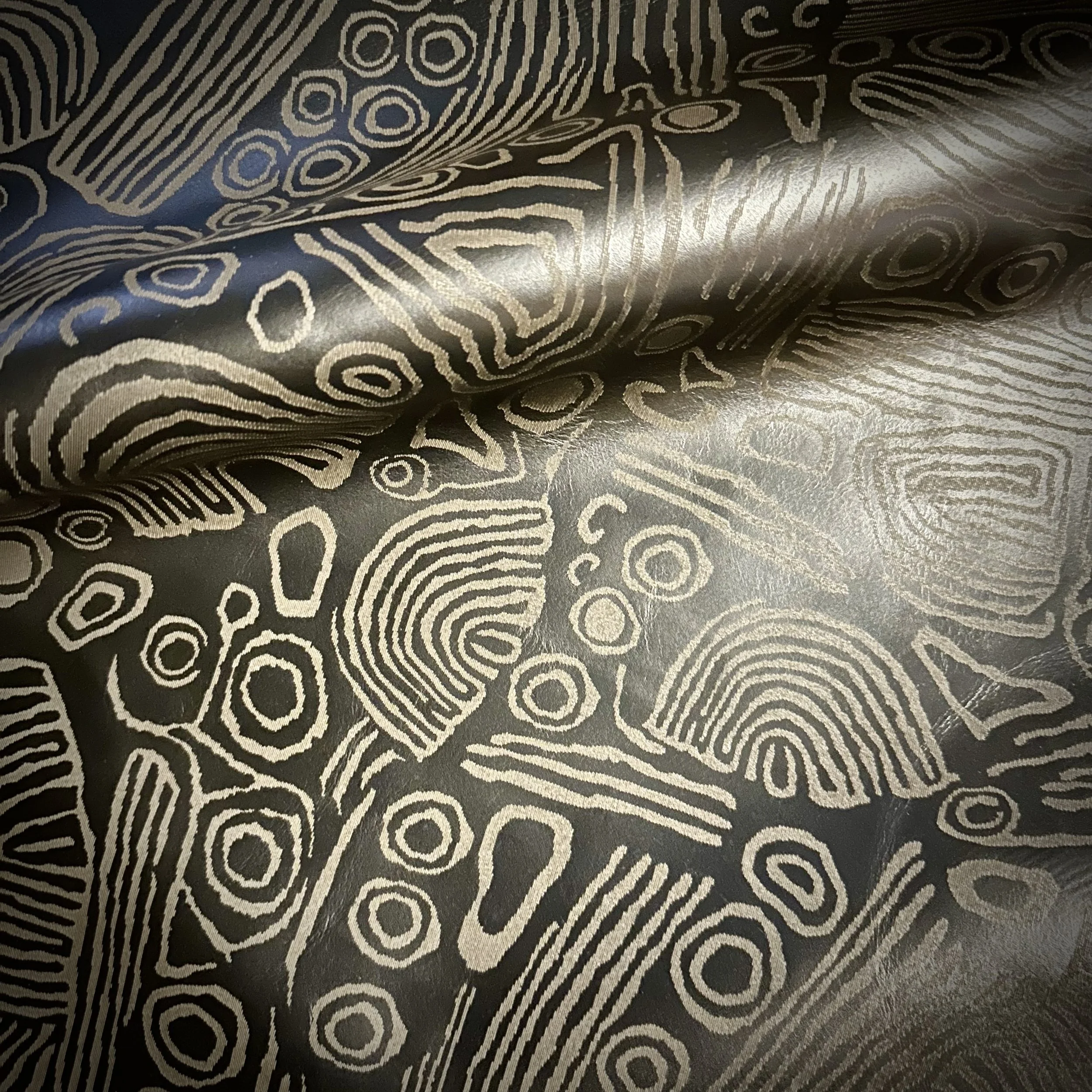 engraved on Maude leather in color clove