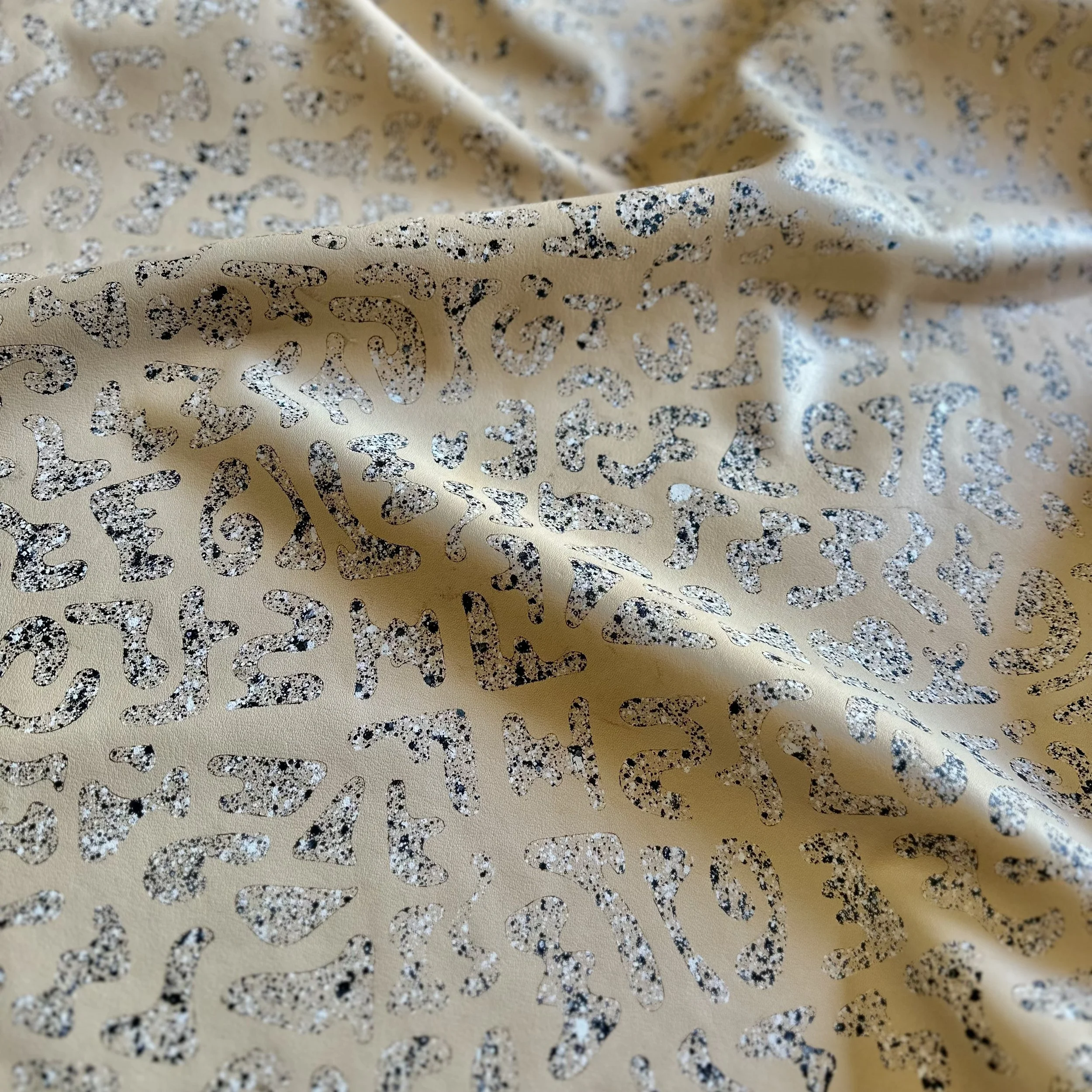 custom stencil etched on maison en cuir in buerre with Galileo paint in black and white