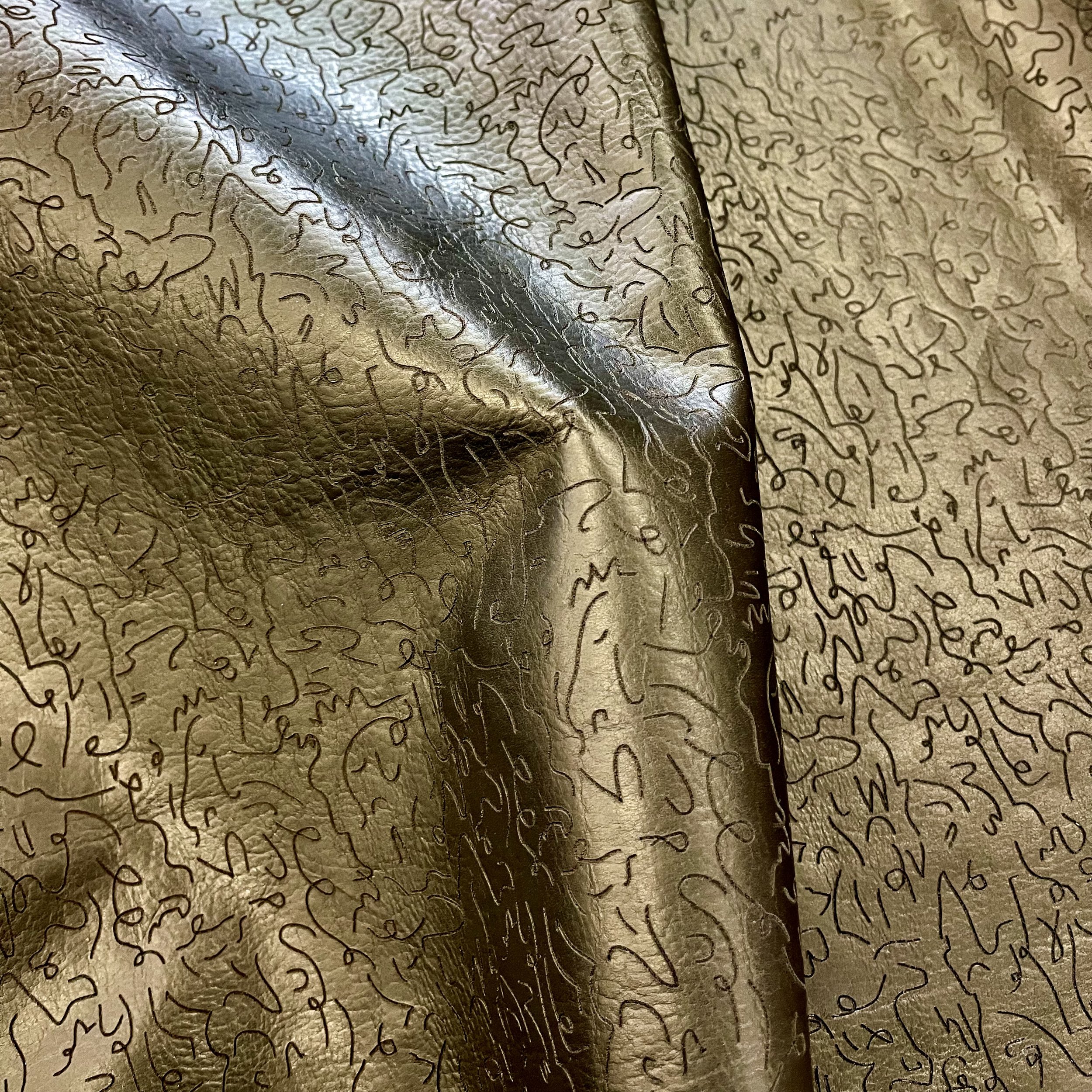 custom etched on Maude leather in clove with mondo bronze paint