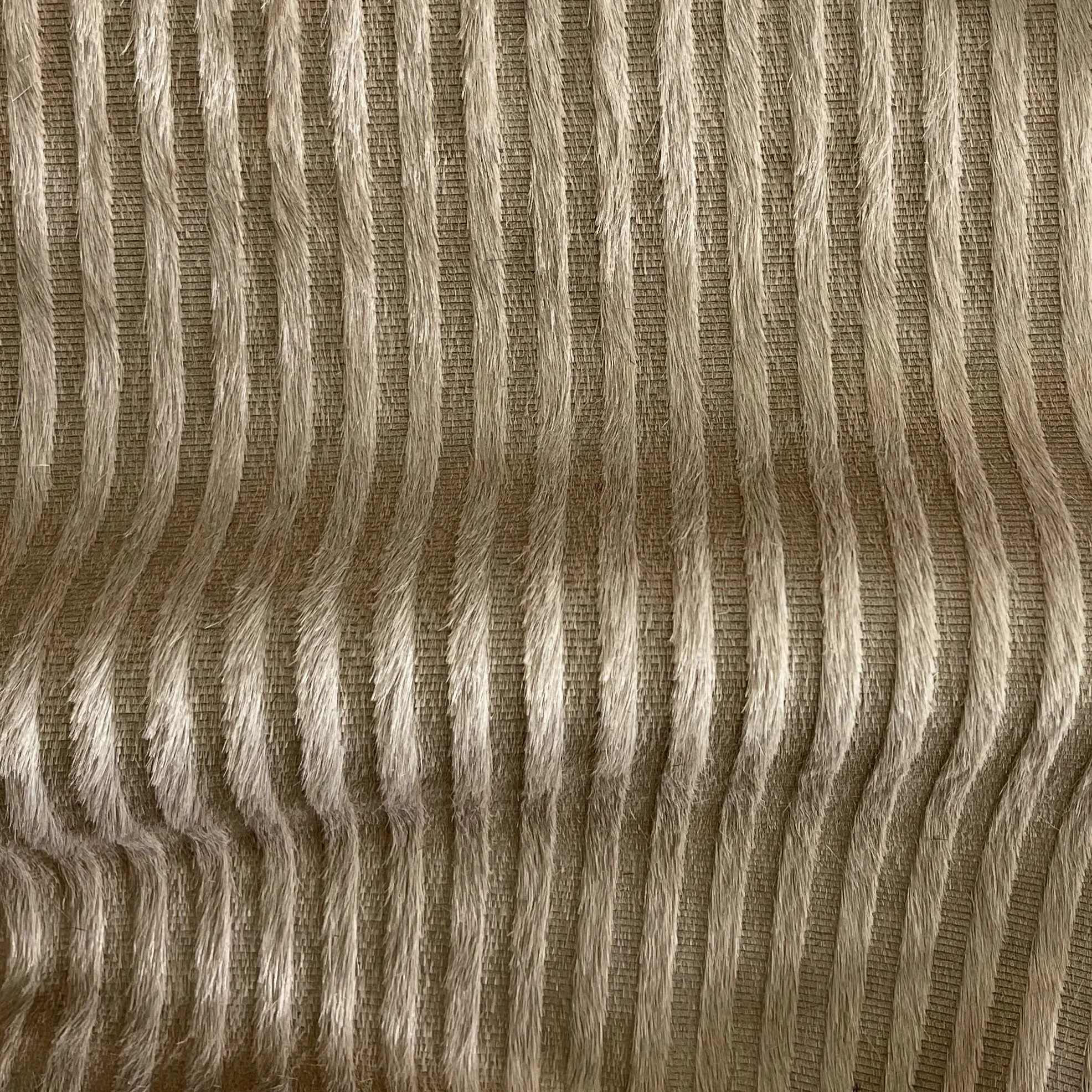 engraved on elsie hair on hide in camel