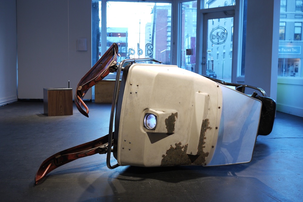  Horse With No Name, 2010, 3’X4”x8’, restored 1970 Johnson Skee Horse, fabricated seat and windshield, color pencil, wax, hardware with patina, digital projection of a photograph of the sun behind clouds&nbsp; 