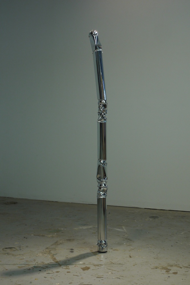  Wizard’s Staff, 2013, 3”x3”x49”, high-­‐polished Budweiser cans, high-­‐polished aluminum pipe, steel, Bondo, silver leaf, felt, lens, iguana skull fragment&nbsp; 