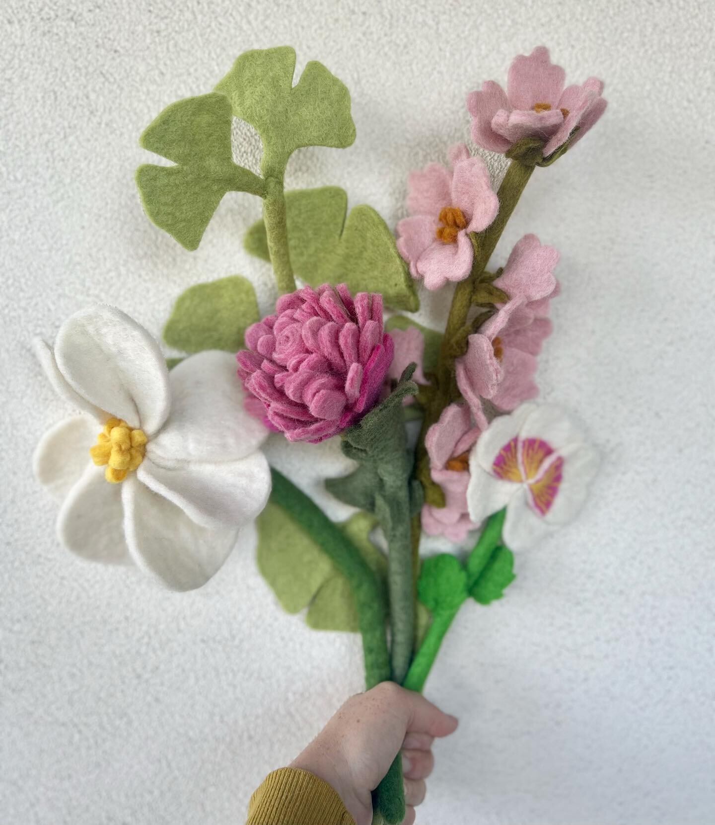 Pretty in pink with cherry blossoms, chrysanthemum, pansy, magnolia, and ginkgo leaves. #thesparrowstudio #feltflowers #magnolia #cherryblossom #ginkgo #pansy