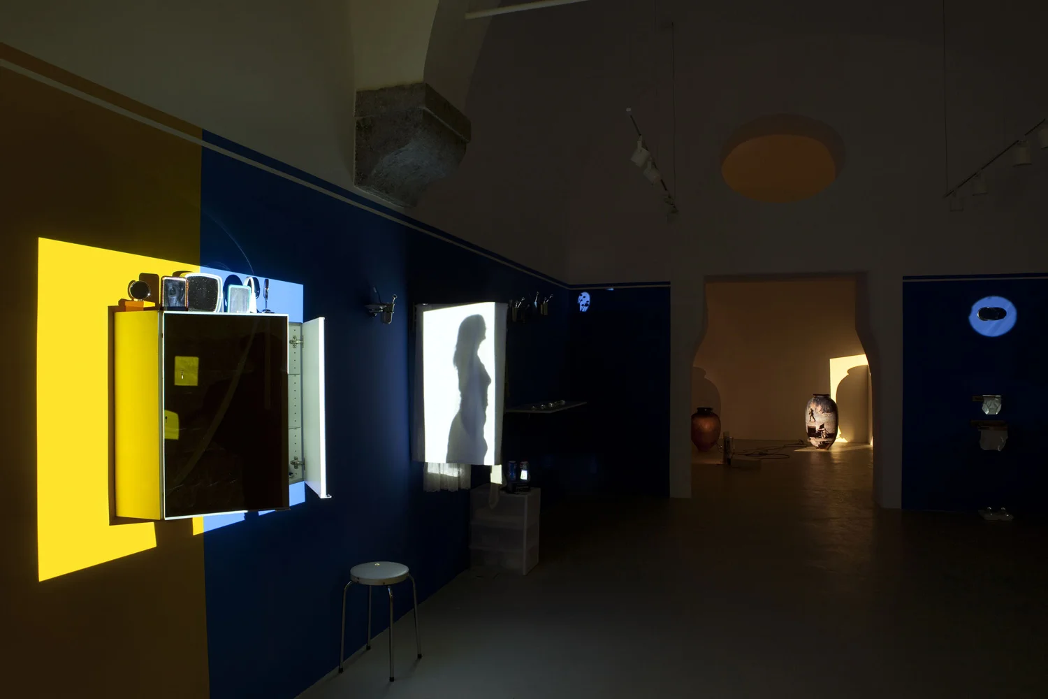 Mother and Father , 2012 Light installation with domestic products and single channel video projection, 08:00 min 8 x 2 x 2 m Edition of 3 +1 AP installation view
