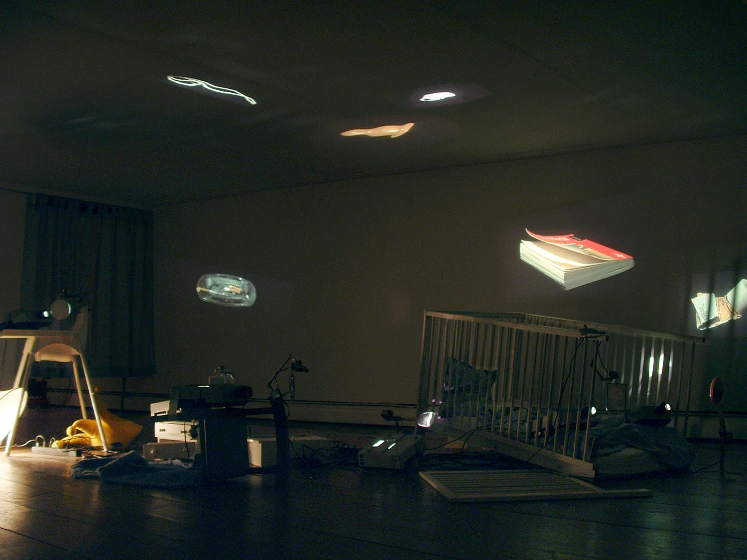 Eulalia Valldosera, Still life (Provisional Living #3), 2000 Installation with slide projectors, mirrors, motors, furniture