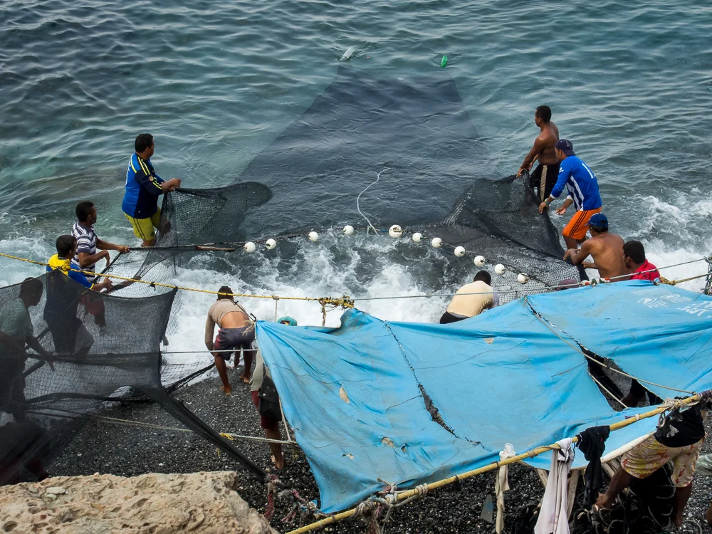 The fishermen work as a team, which is essential to manage the work load, especially at the end of the day. In this series, I photographed the daily happenings of a group of fishermen in the small town of Taganga, on the northern coast of Colombia. They use a simple yet effective method, common of indigenous groups, that has been passed down through generations. Their connection to the sea and their commitment to this way of life persists despite the amassing threats of pollution and over-fishing by commercial enterprises.