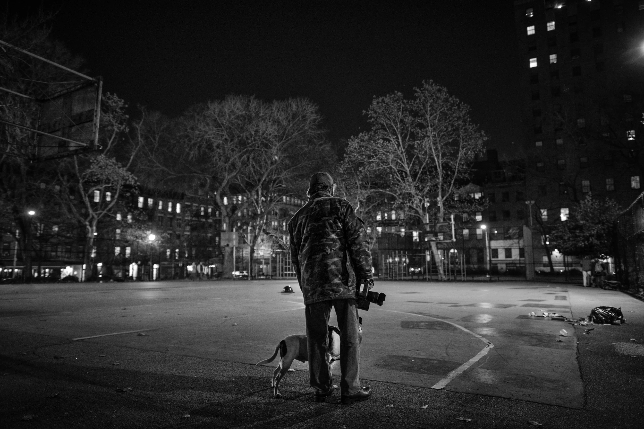  Bill and Paco, 6, stand looking for potential lucrative hunting spots inside of Tompins Square Park. 