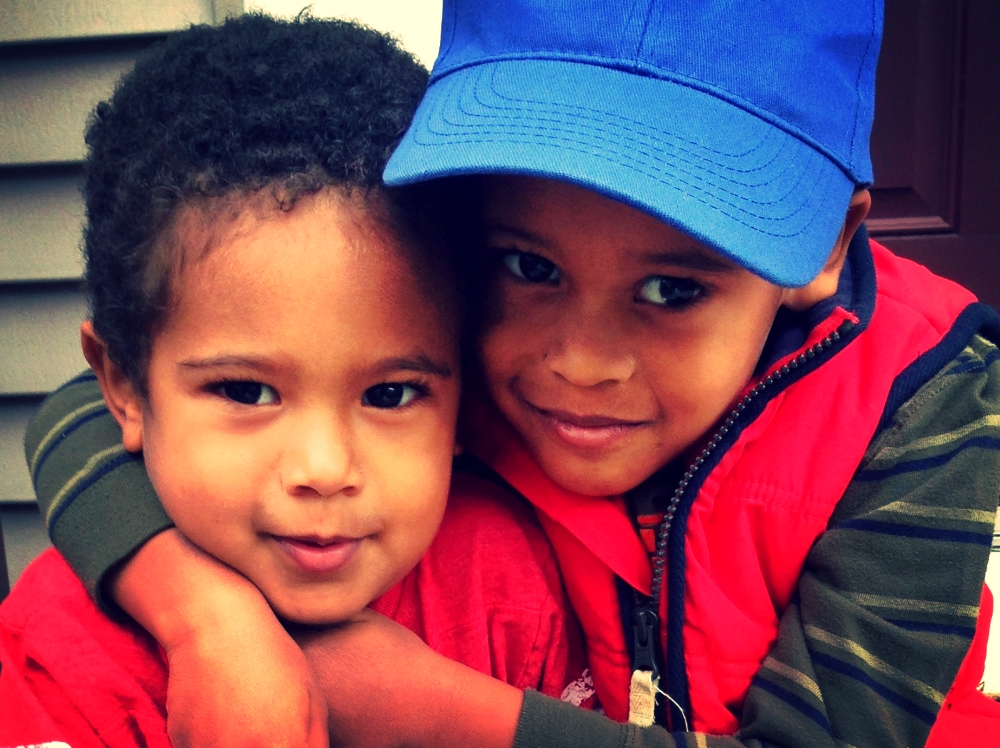 Julian illustrates the delicate line between a hug and a chokehold.