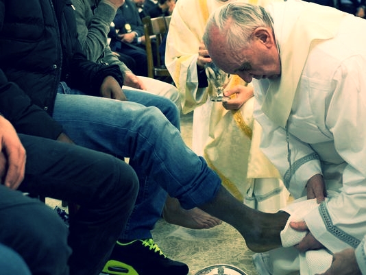 "Washing your feet means I am at your service," Pope Francis said to the youth whose feet he washed on Holy Thursday 2013.