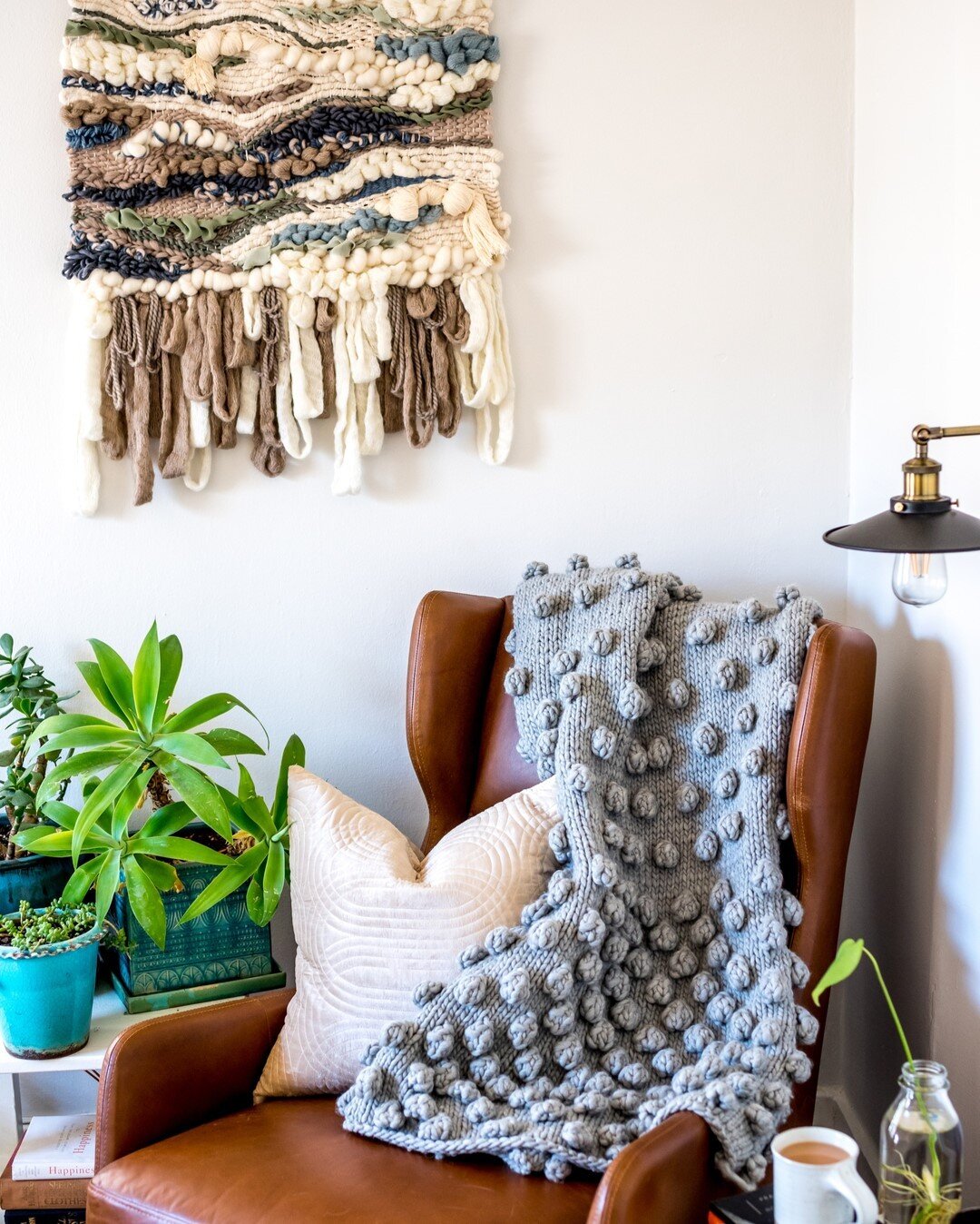 This weaving by @beccaboojane was inspired by an ocean storm. When I look it I can almost smell the salt spray and hear the rumble of surf. I feel like I'm home. Also, I *finally* finished the falling bobble afghan (pattern @purlsoho @purlsohobusyhan