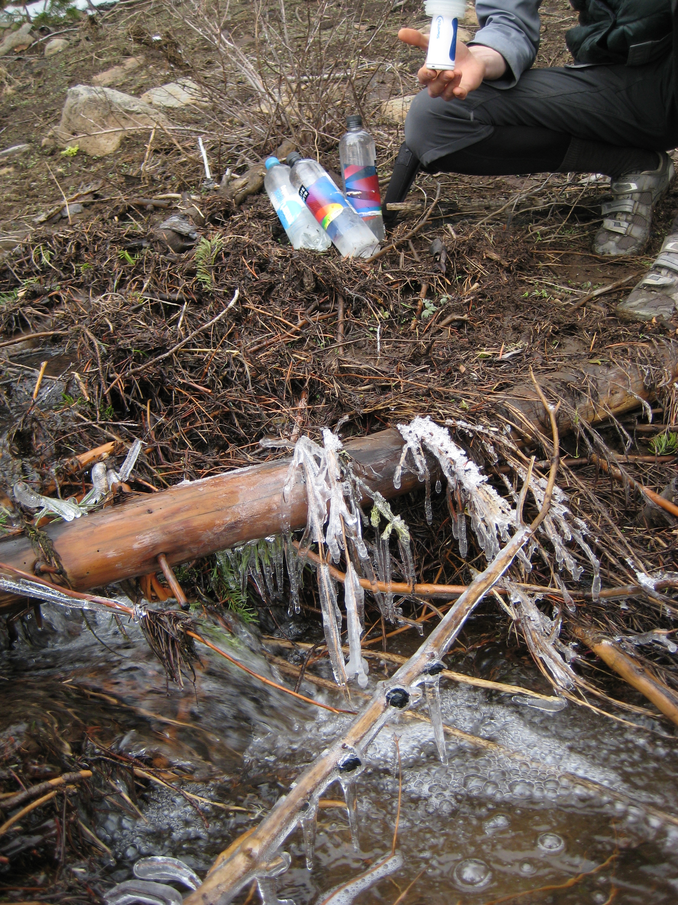 Filtering water from frozen streams.