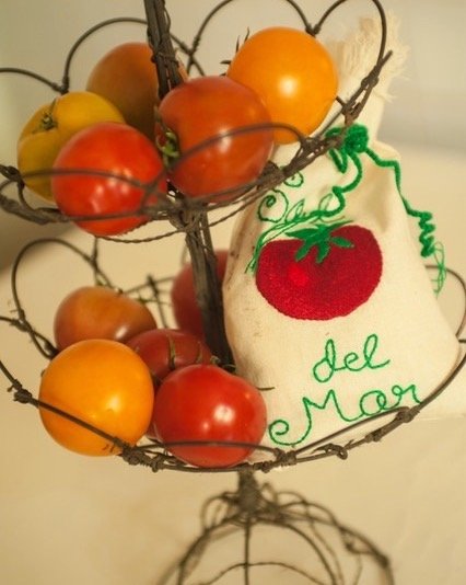 We can&rsquo;t resist showing off our hand-embroidered bag we call &ldquo;Hot Tomato&rdquo;with the ludicrously delicious heirloom tomatoes. A pinch of our Sal del Mar gourmet sea salt enhances the flavor even more! And if you&rsquo;ve never seen our