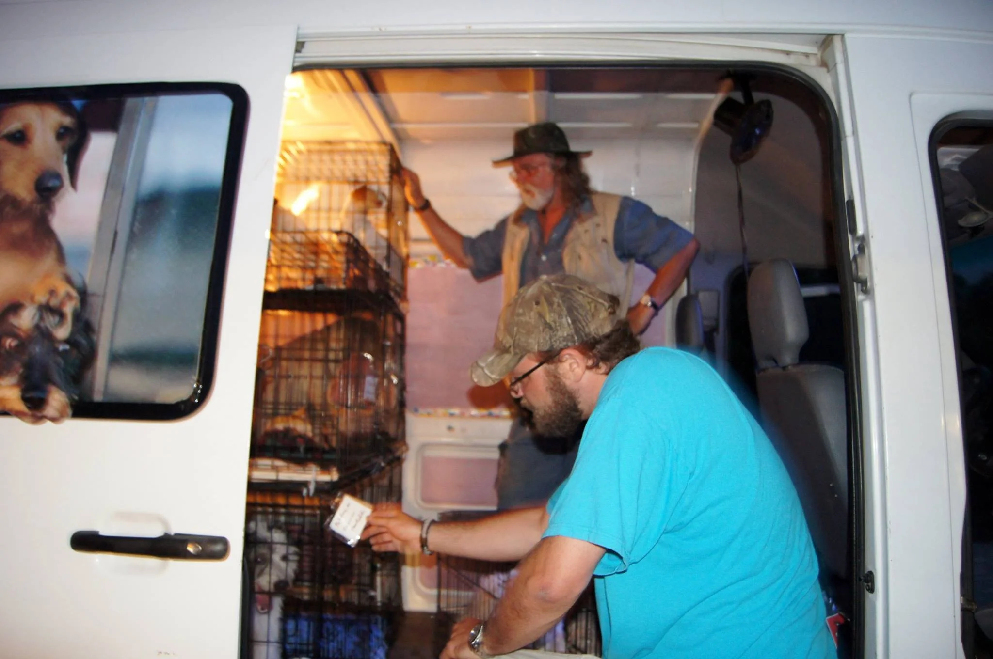 Paw Posse's two drivers making sure everything is safe for the critters.