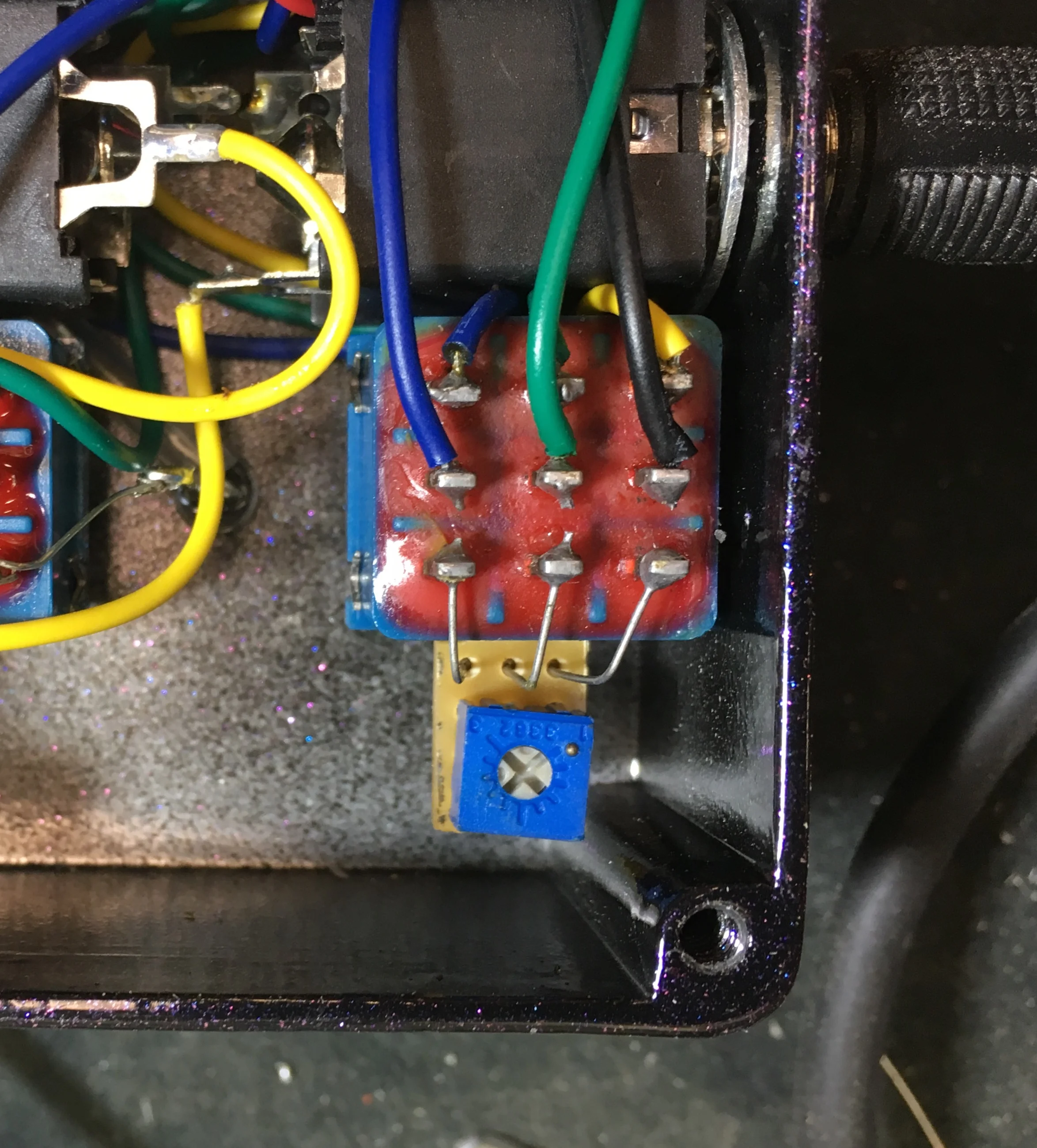 OSC switch trimpot, it leaves the shop at maximum effect. Rotate it counterclockwise just a hair to lessen/slow the oscillation.