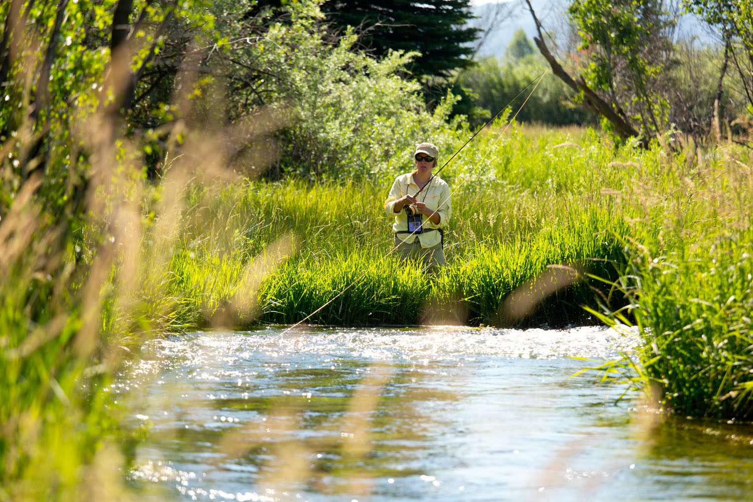  Lifestyle: Kara Armano fly fishing a spring creek along the Roaring Fork River, Carbondale, Colorado 