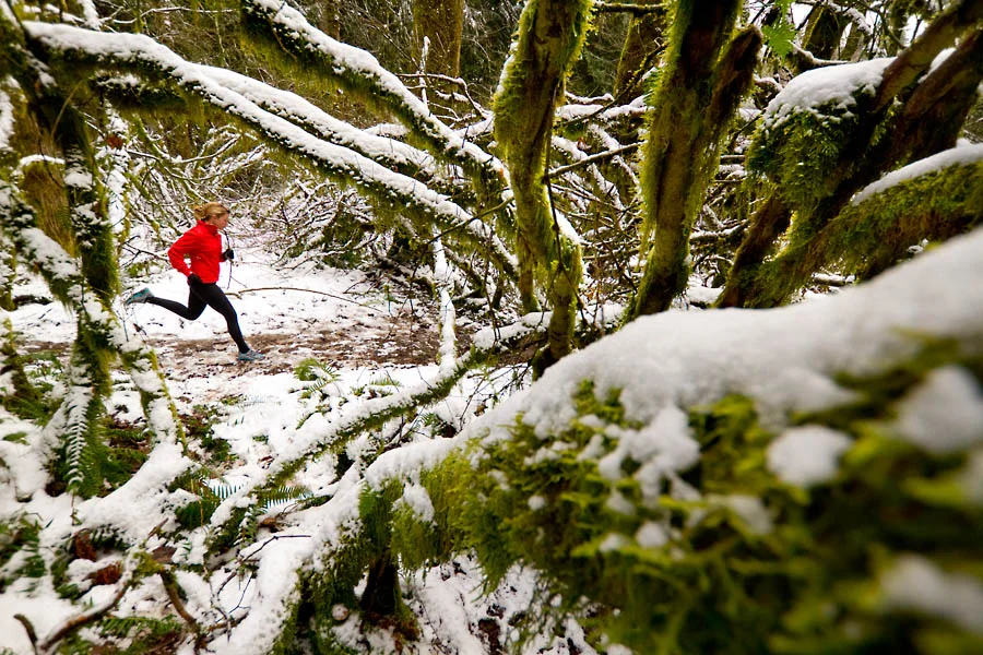 Maria Vucheva trail running in the snow, Tiger Mountain State Forest, Central Cascades, Washington