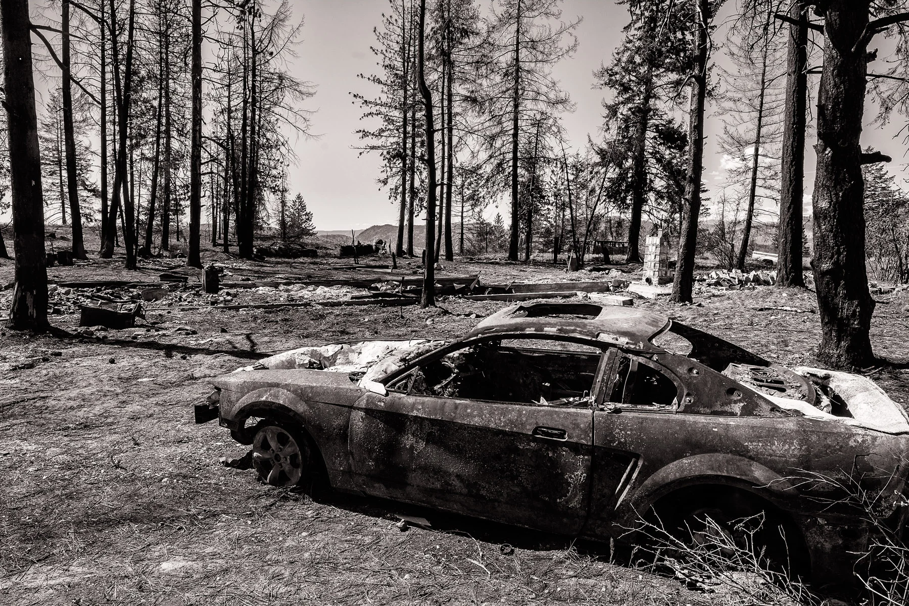 Conservation: A burned car and home after a record breaking wildfire in Eastern Washington