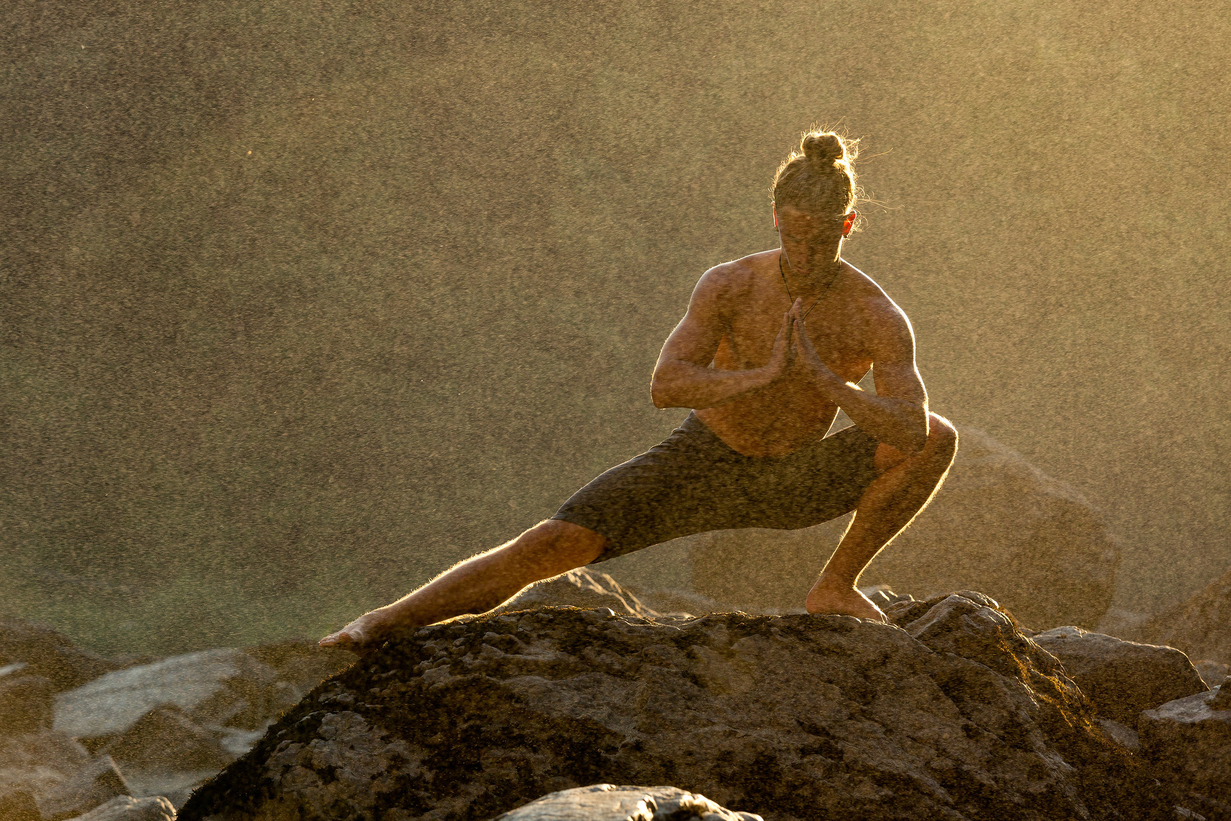  Lifestyle: Jamie Finnan practicing yoga below Snoqualmie Falls, Central Cascade Mountains, Washington 