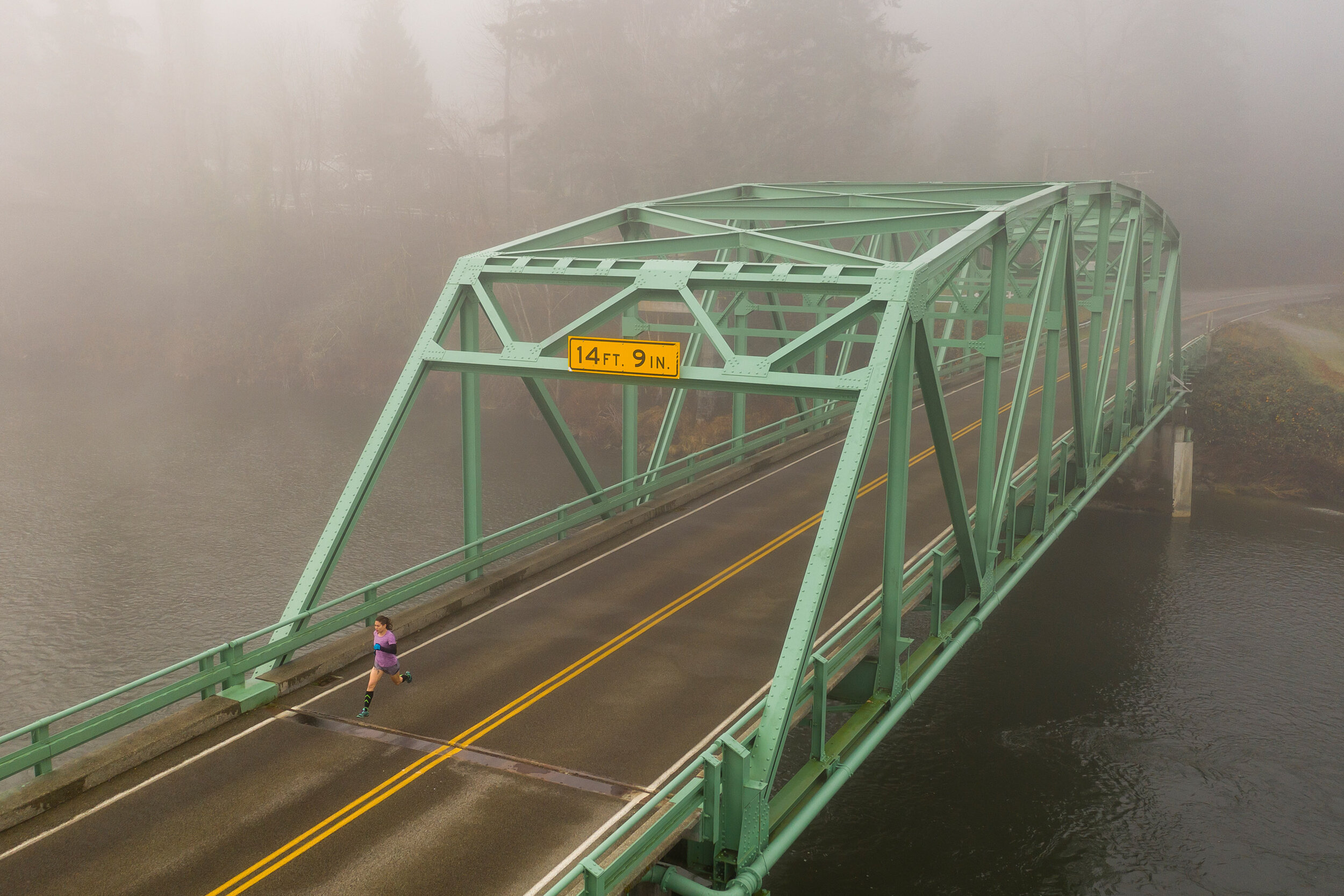  Fitness: Ariel Gliboff road running on a foggy autumn morning in the Snoqualmie Valley, Washington 