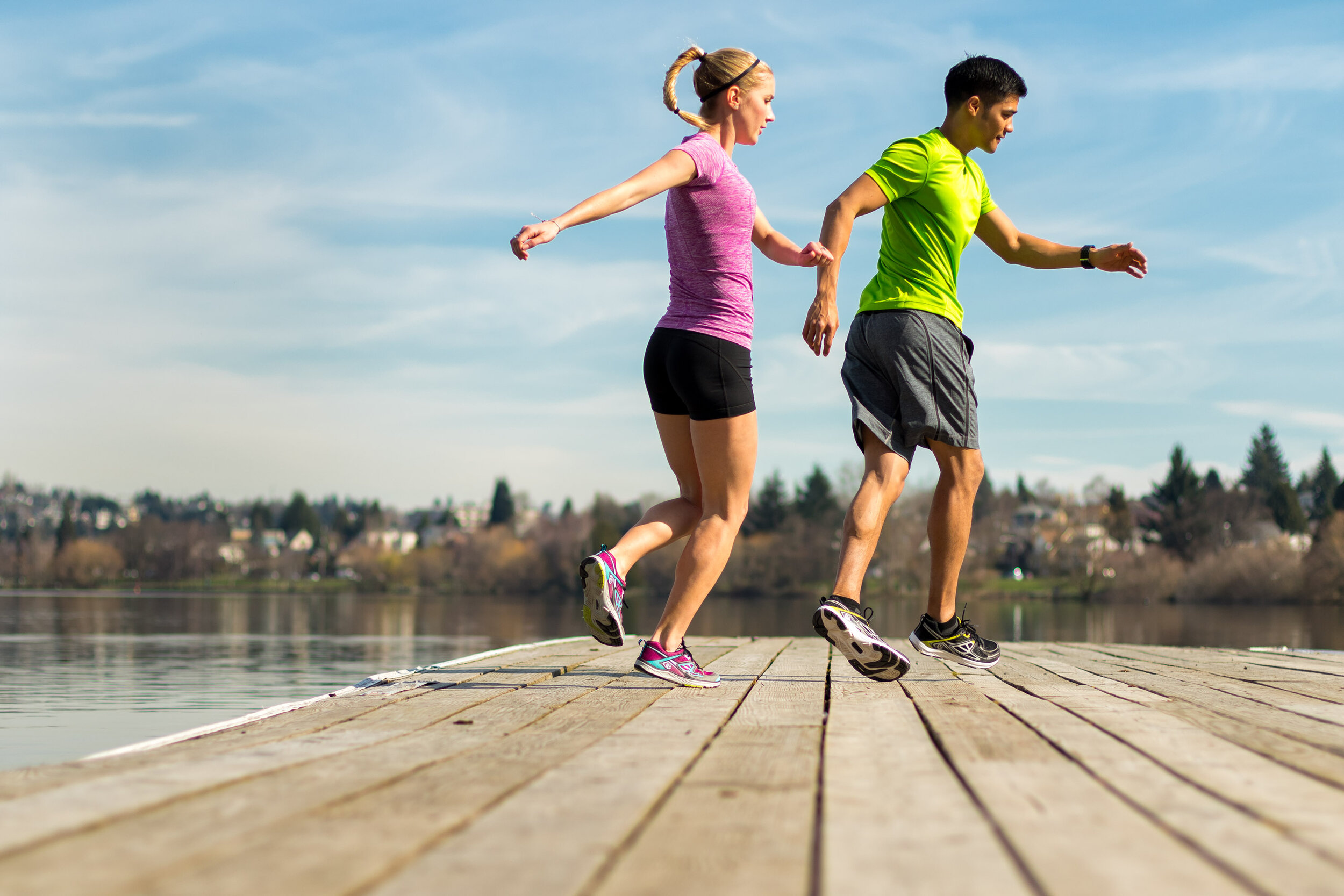  Fitness: Bronwyn Crossman and Andrew Ignacio exercising on a dock at Green Lake, Seattle, Washington 