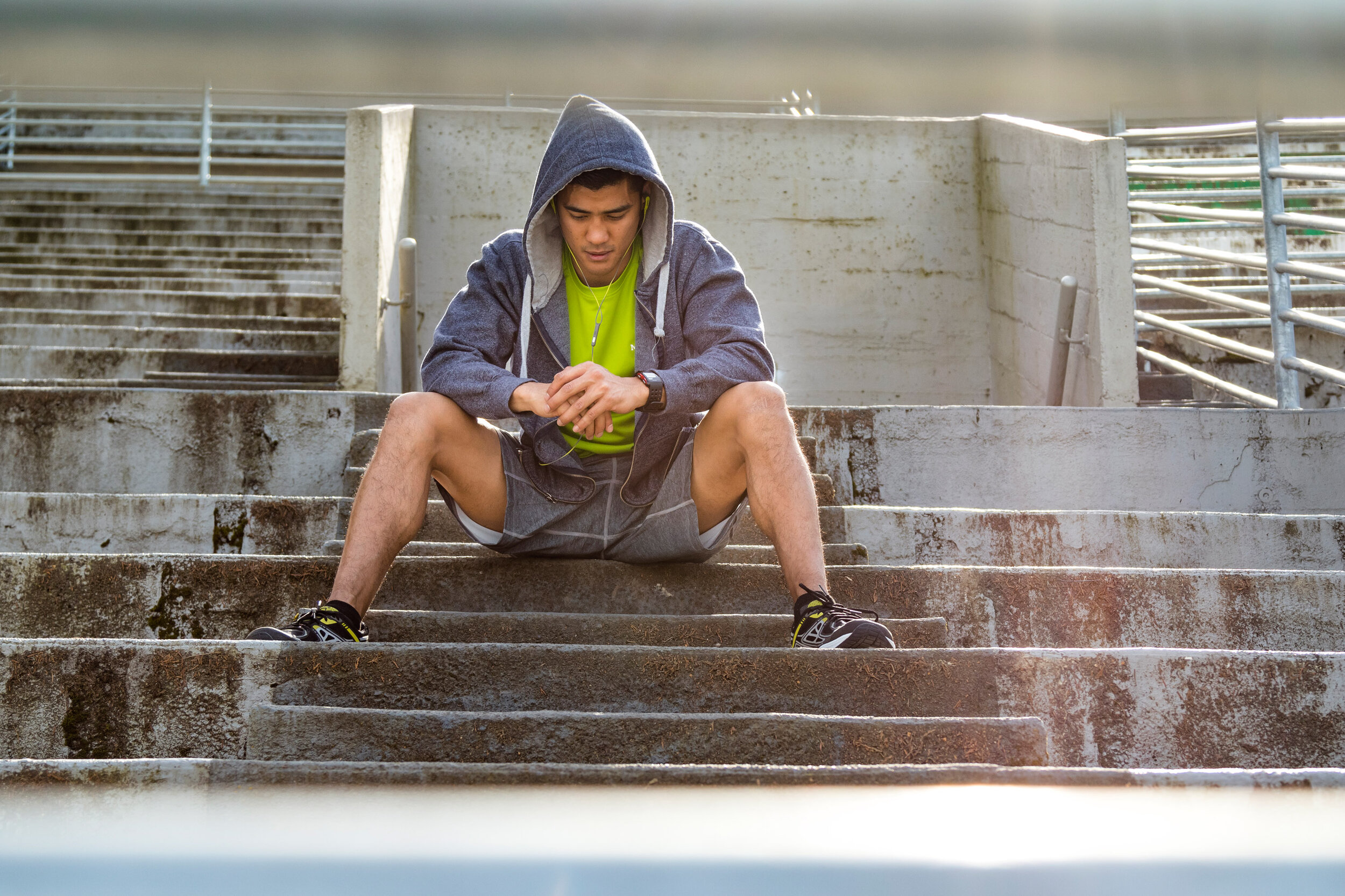  Fitness: A young man rests after a run near Green Lake in Seattle in summer, Seattle, Washington 