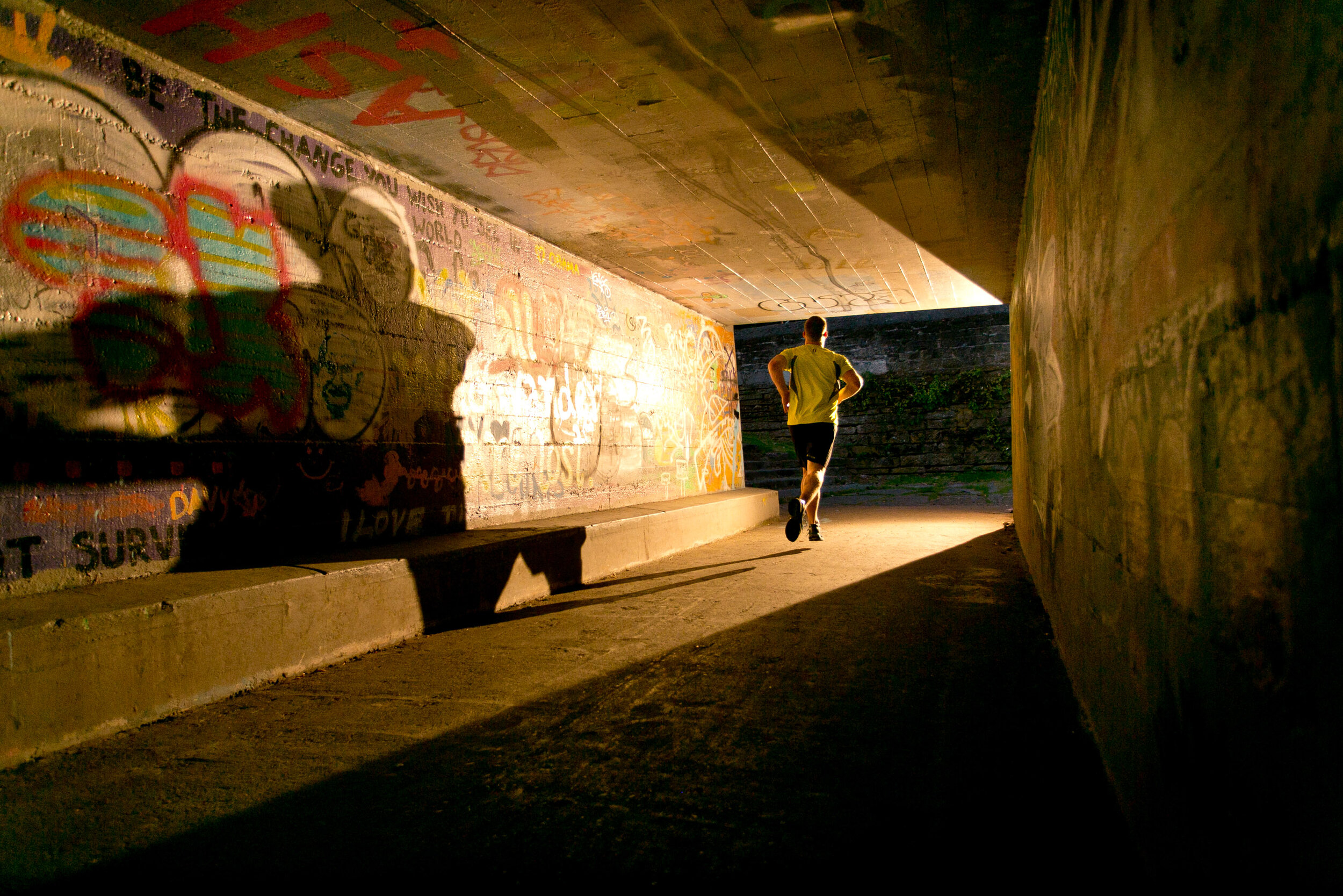  Lifestyle: Michael Hildebrand running a pedestiran tunnel under train tracks at Golden Gardens Park, Seattle 