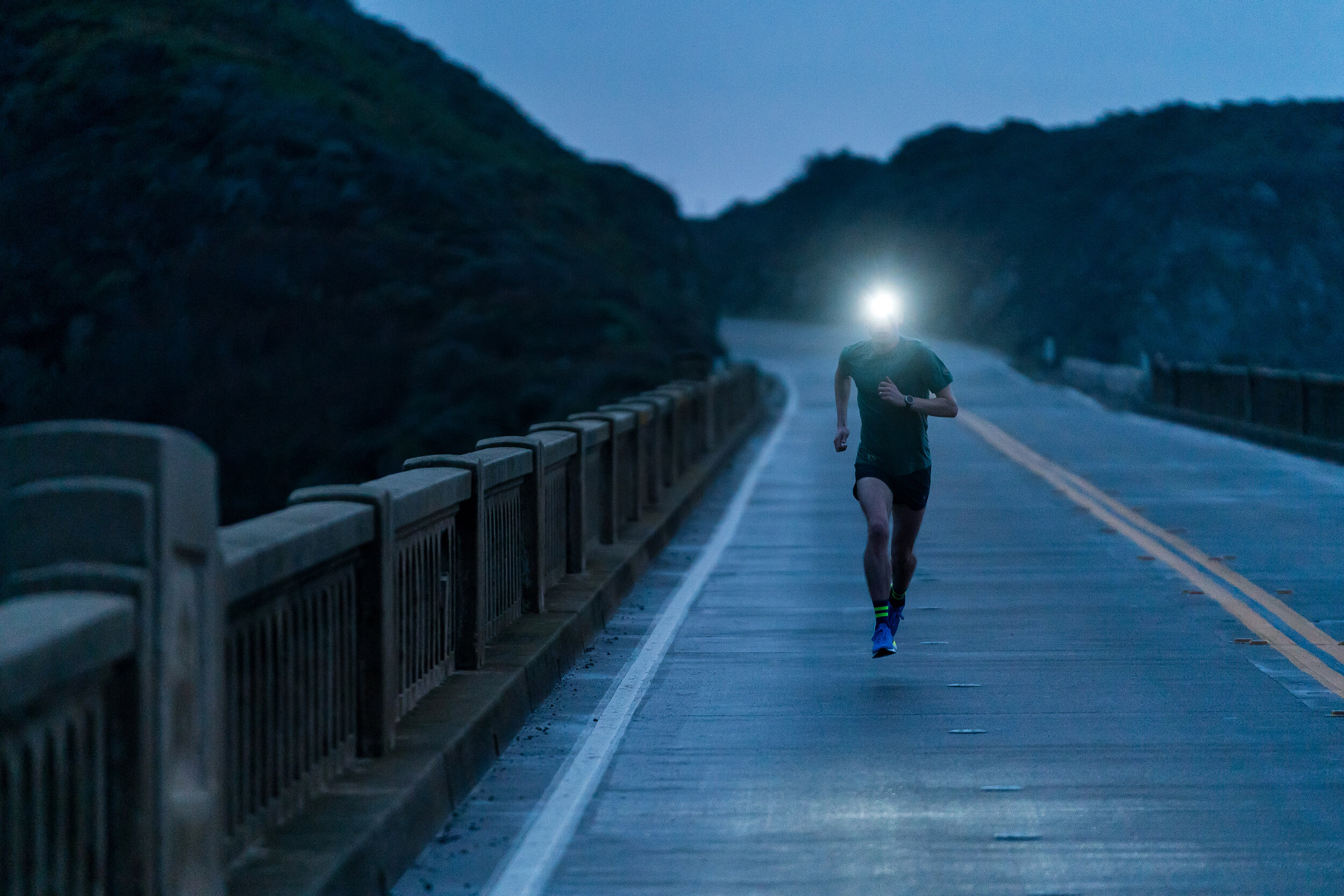 Adventure: Josh Dedering road running at dusk by headlamp along the Big Sur Coast, California 