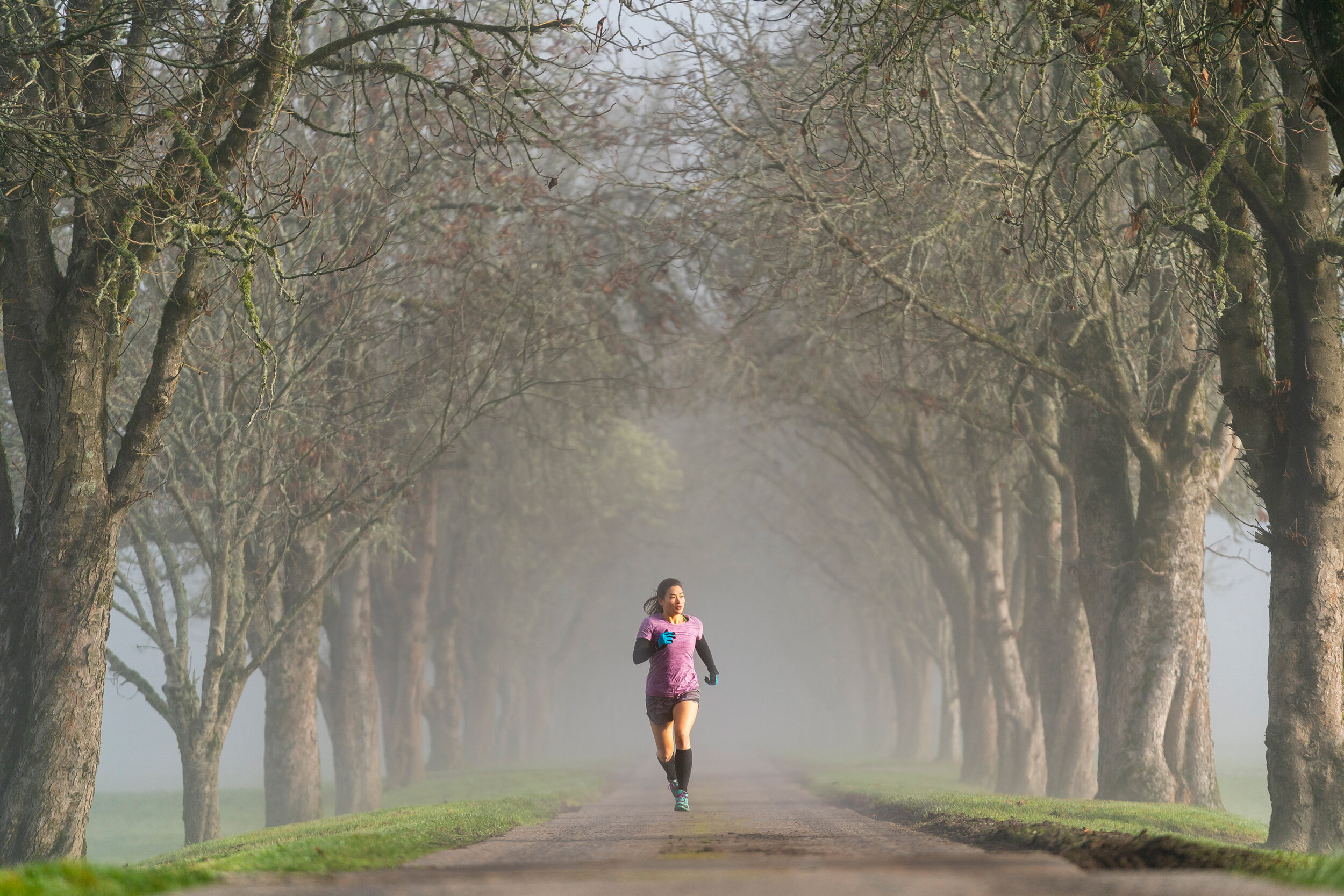  Fitness: Ariel Gliboff road running on a foggy autumn morning in the Snoqualmie Valley, Washington 