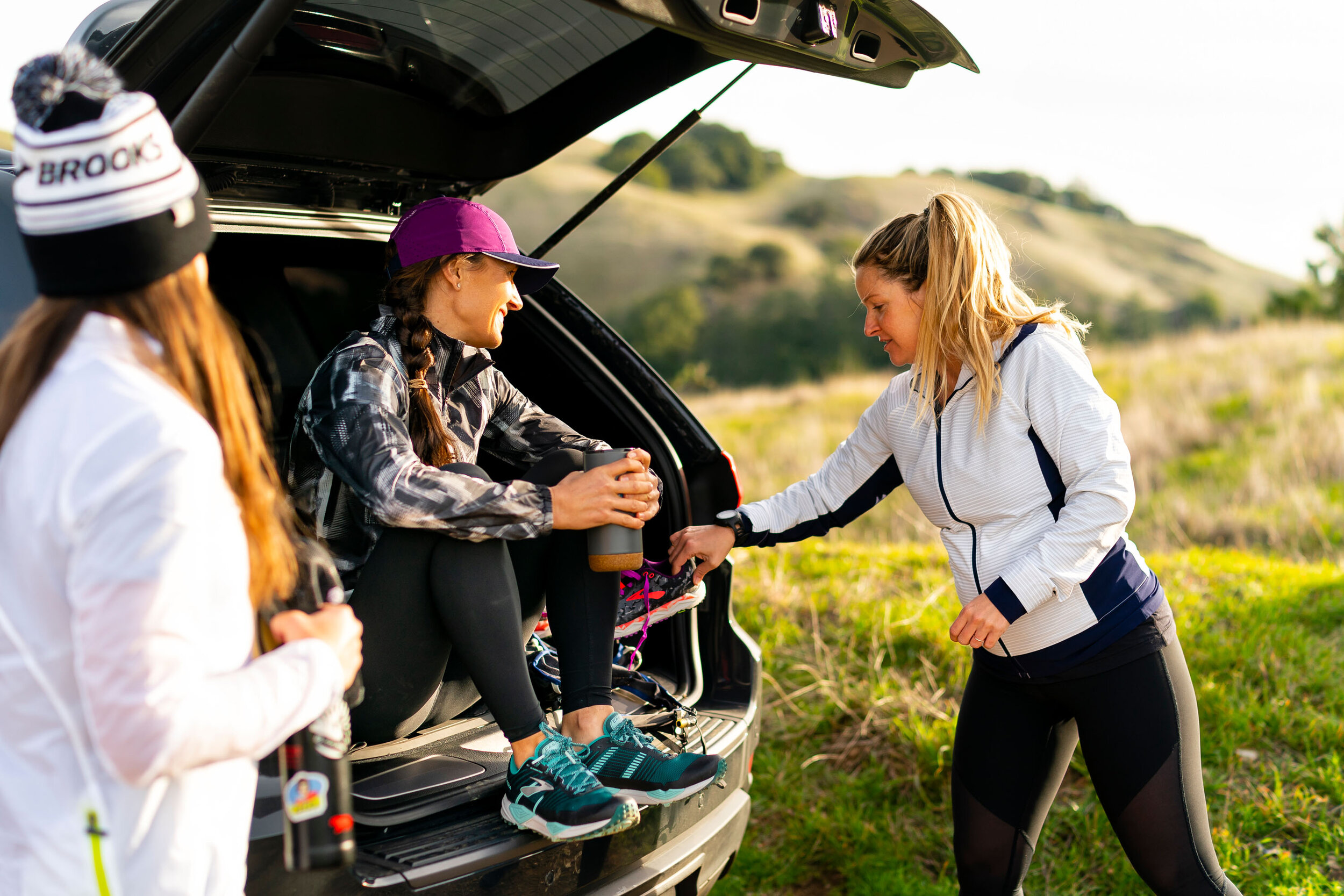  Adventure: Julia Malon, Roxanne Vogel, and Caitlin Landesburg getting ready for a trail run at Mt. Tamalpais, Marin County, California 