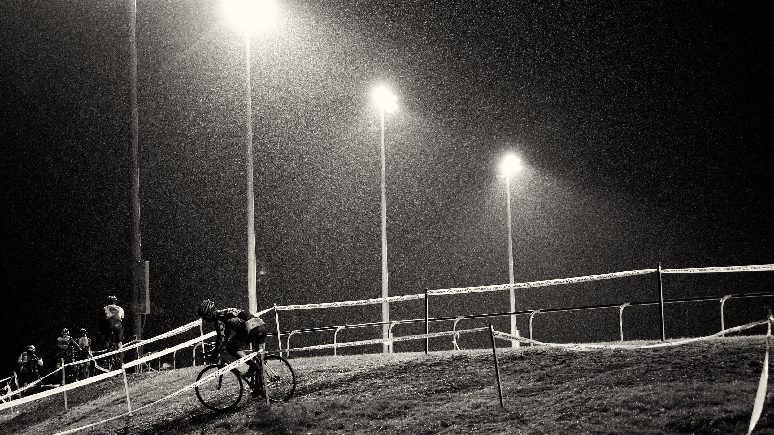  Competition: Cyclocross racers during a race on a rainy night at Marmoor Park, Redmond, Washington 