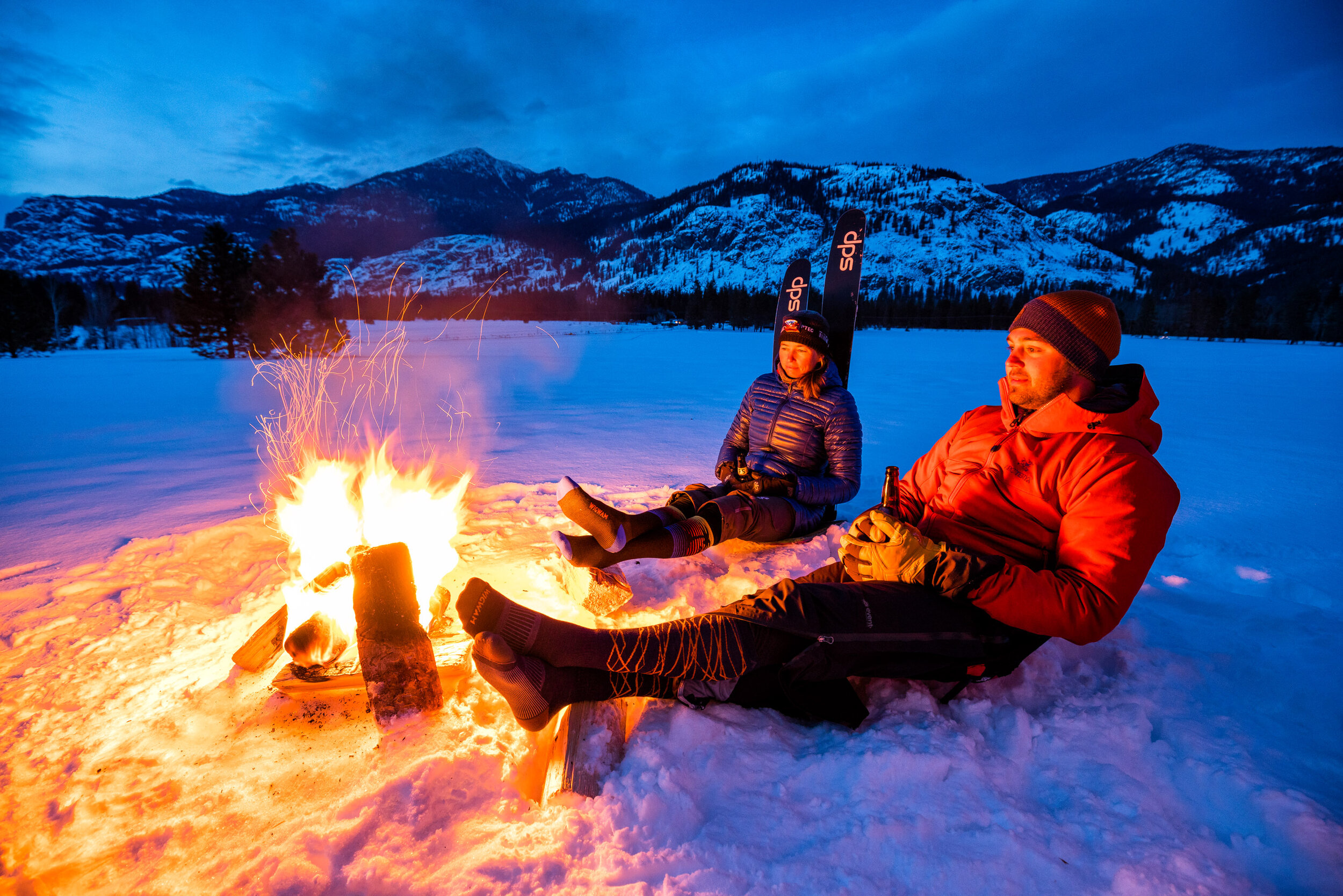  Lifestyle: Steph Williams and Dave Summers hanging out at a fire after a ski tour in the Methow Valley, Washington 