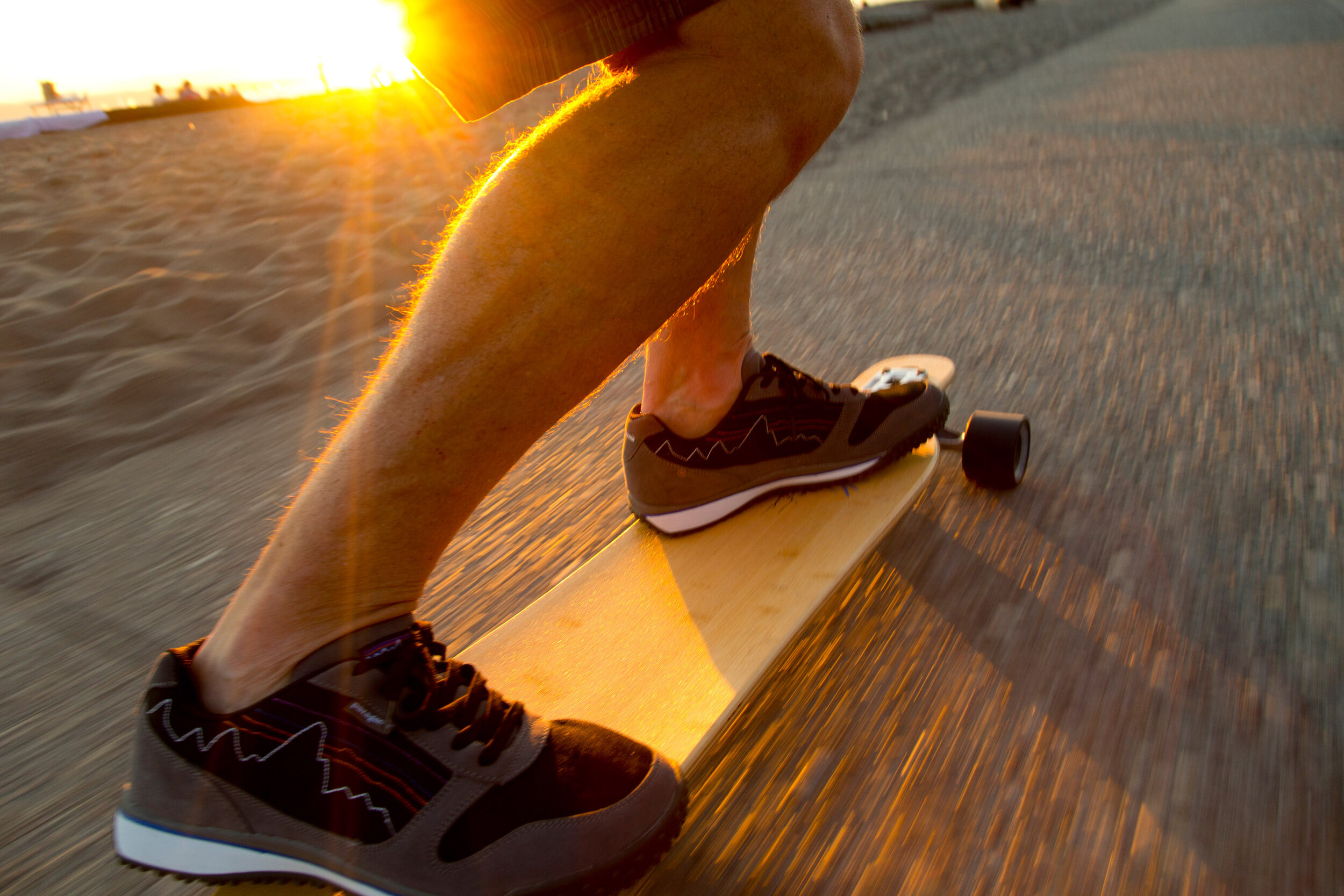  Lifestyle: A man skateboarding at Golden Gardens beach at sunset, Seattle 