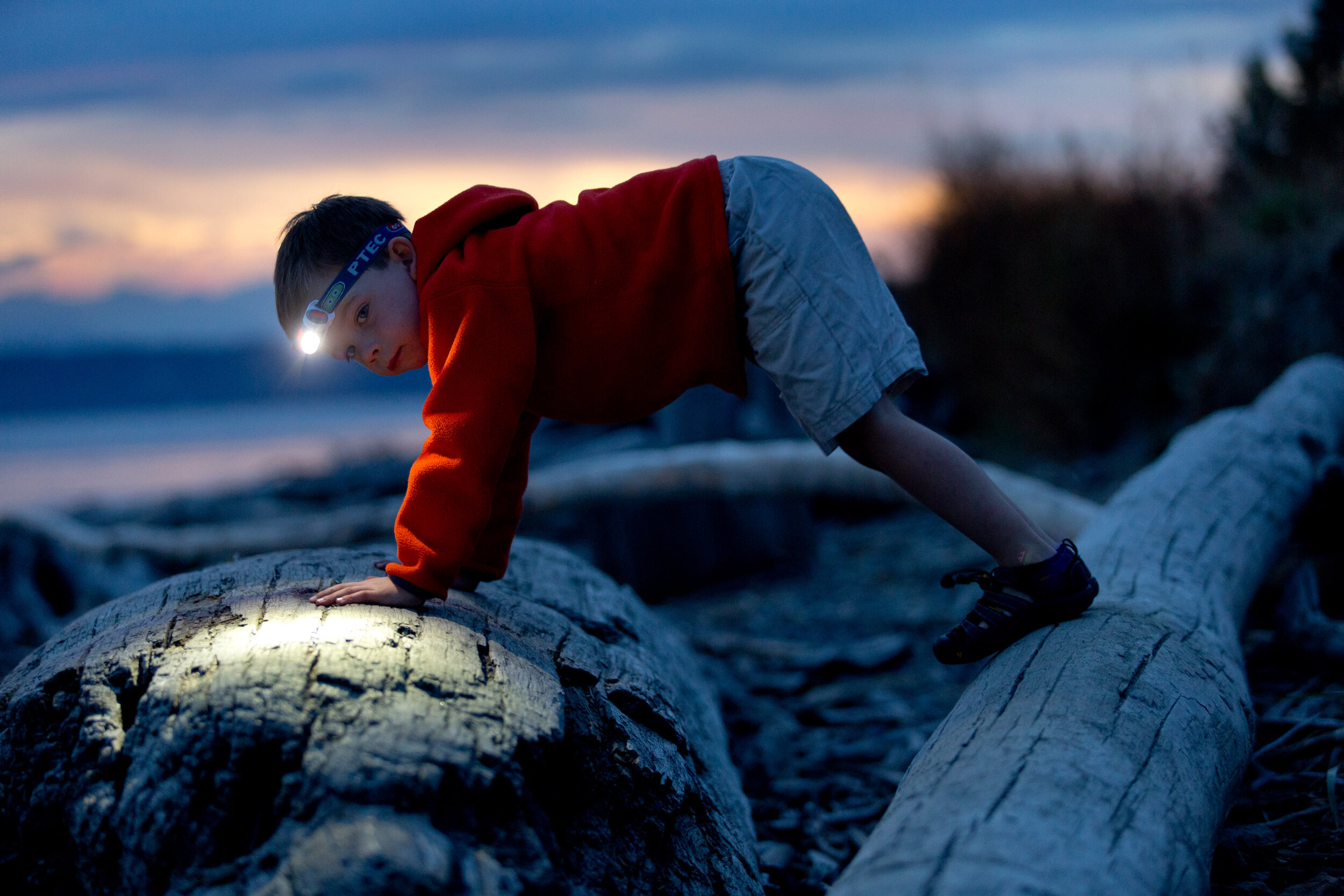  Lifestyle: Jackson Matera playing on the beach at dusk by headlamp, Discovery Park, Seattle 