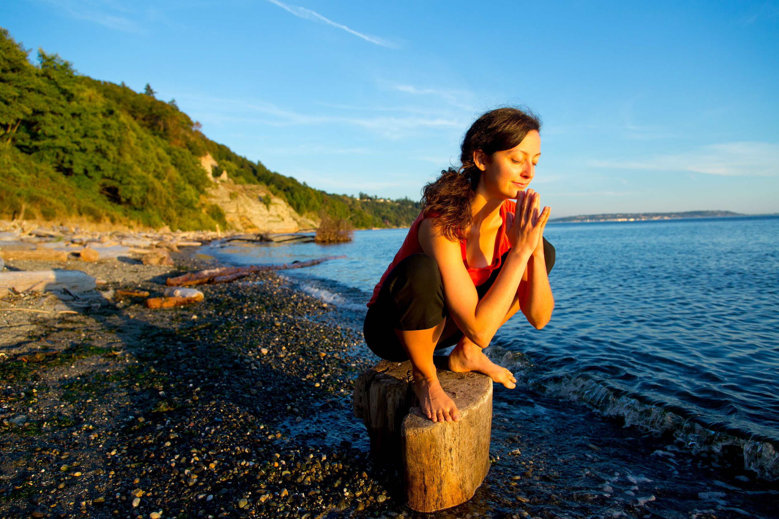  Lifestyle: Elizabeth Kovar doing yoga on the beach at Discovery Park at sunset, Seattle 