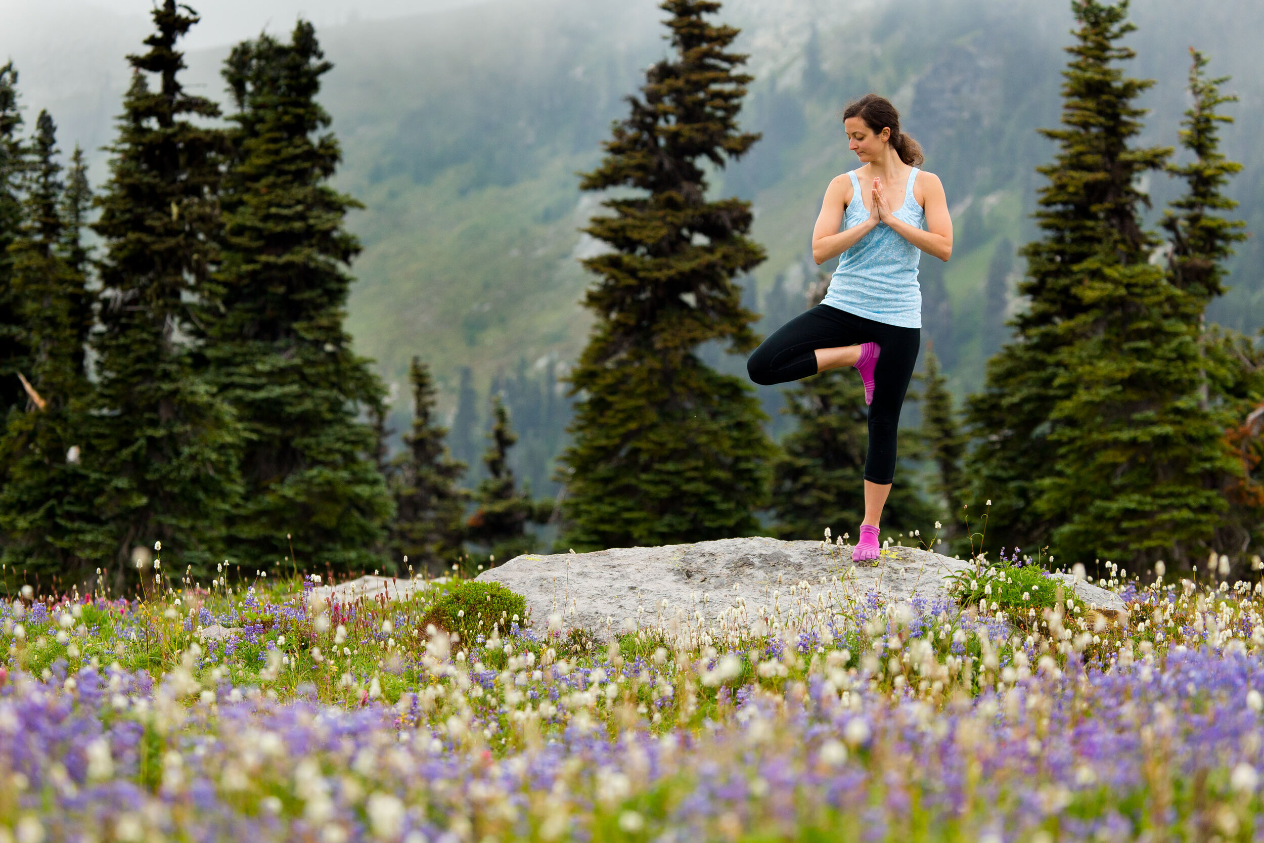  Lifestyle: Elizabeth Kovar does yoga in the summer wildflowers, Spray Park, Mt. Rainier, Washington 