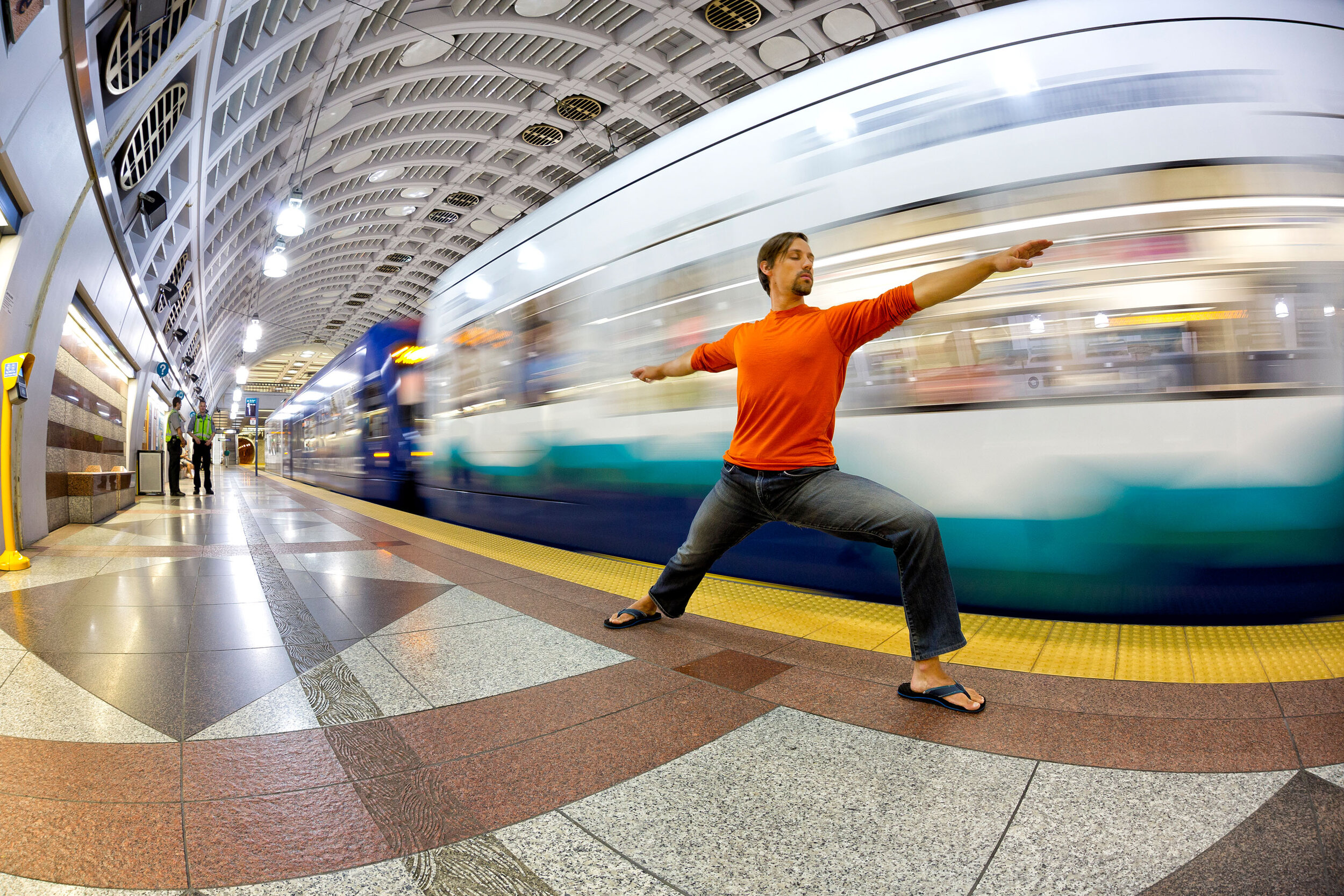  Lifestyle: A man practicing urban yoga in Pioneer Square train tunnel, Seattle, Washington 