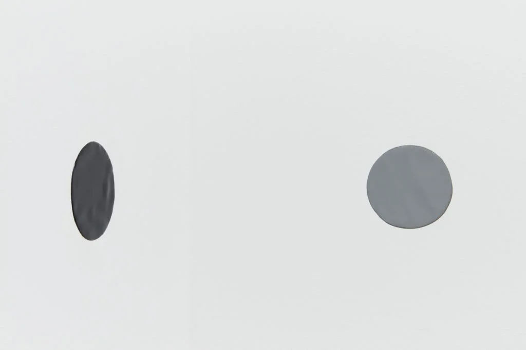   Circle (gray and black) , 2019, enamel on lead embedded in sheetrock wall, each 4” in diameter, installation view,  Chapter 4: arms ache avid aeon: Nancy Brooks Brody / Joy Episalla / Zoe Leonard / Carrie Yamaoka: fierce pussy amplified , Beeler Ga