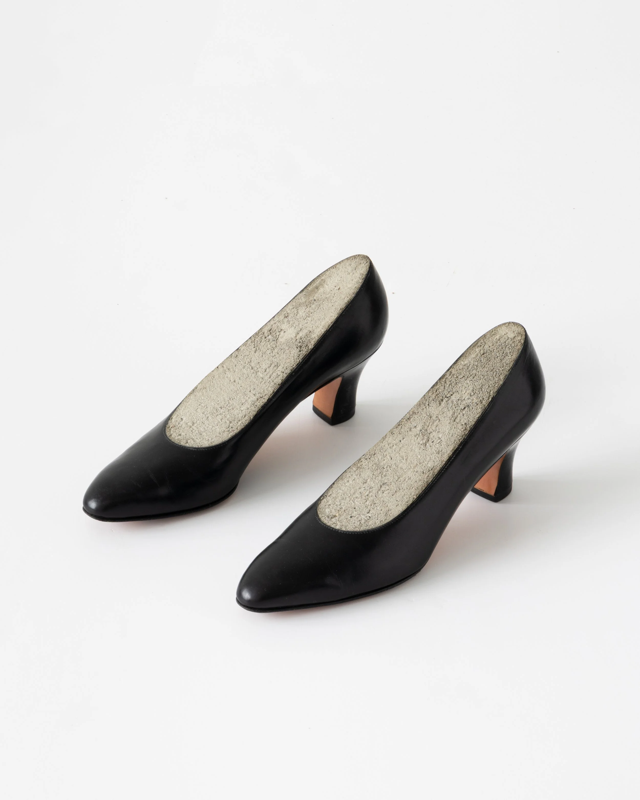   Cement Shoes , 2001/2018, leather pumps, concrete, each 5 x 10 1/2 x 3”. Photo: Jenny Gorman.&nbsp; 