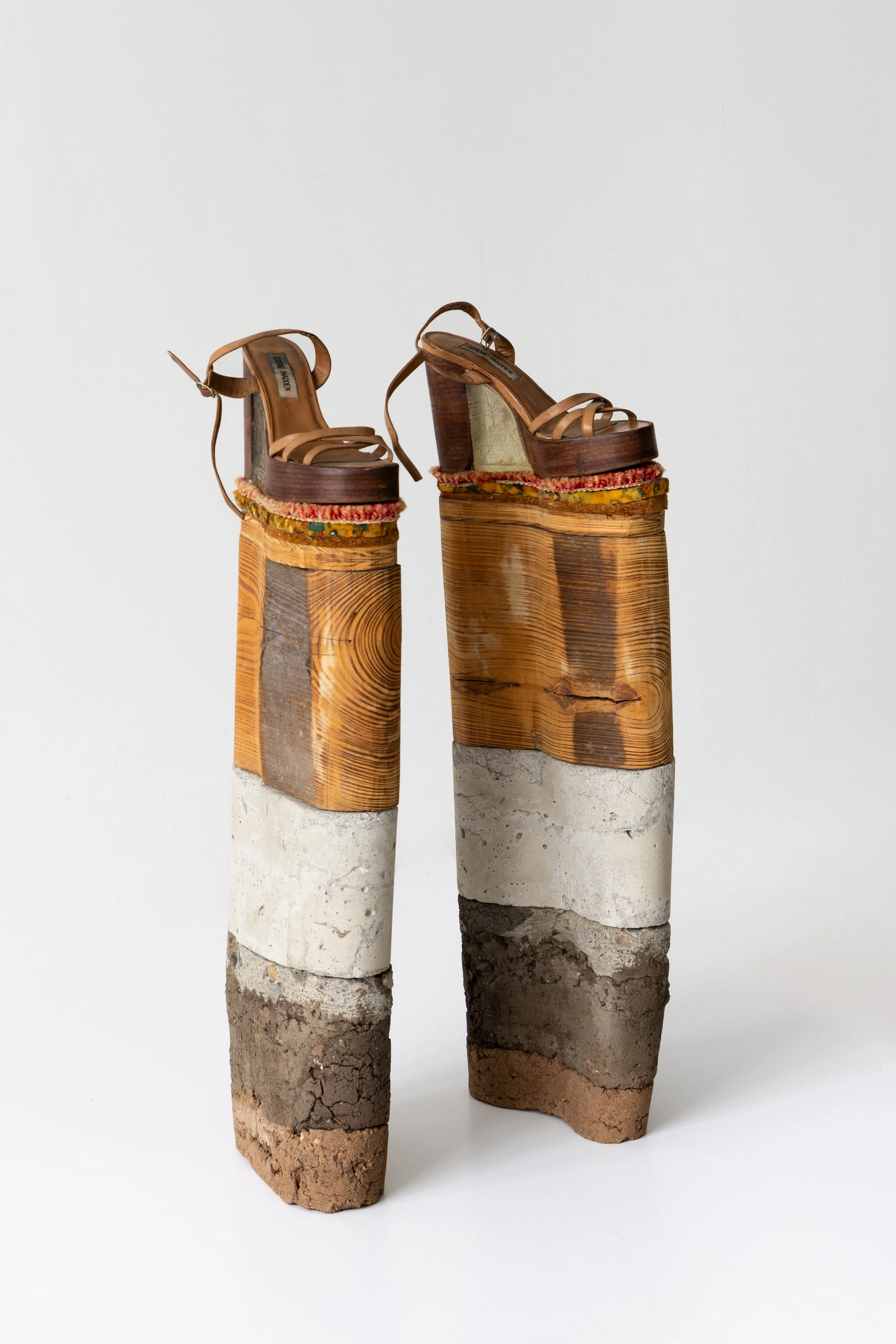   Platforms , 2000, leather shoes, resin, synthetic carpet, carpet padding, plywood, pine wood joist, concrete, and dirt, each 25 1/2 x 9 x 4 1/2”. Photo: Jenny Gorman.&nbsp; 