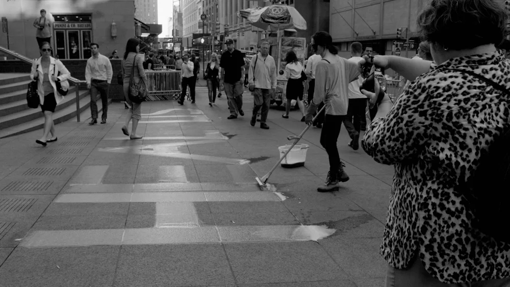 PLATE 24. Lia Chavez. True Light: Heal Us/Heal U.S. , 2012. Zuccotti Park, New York. Water, Mrs. Meyer’s All Purpose Cleaner, sponge mop.