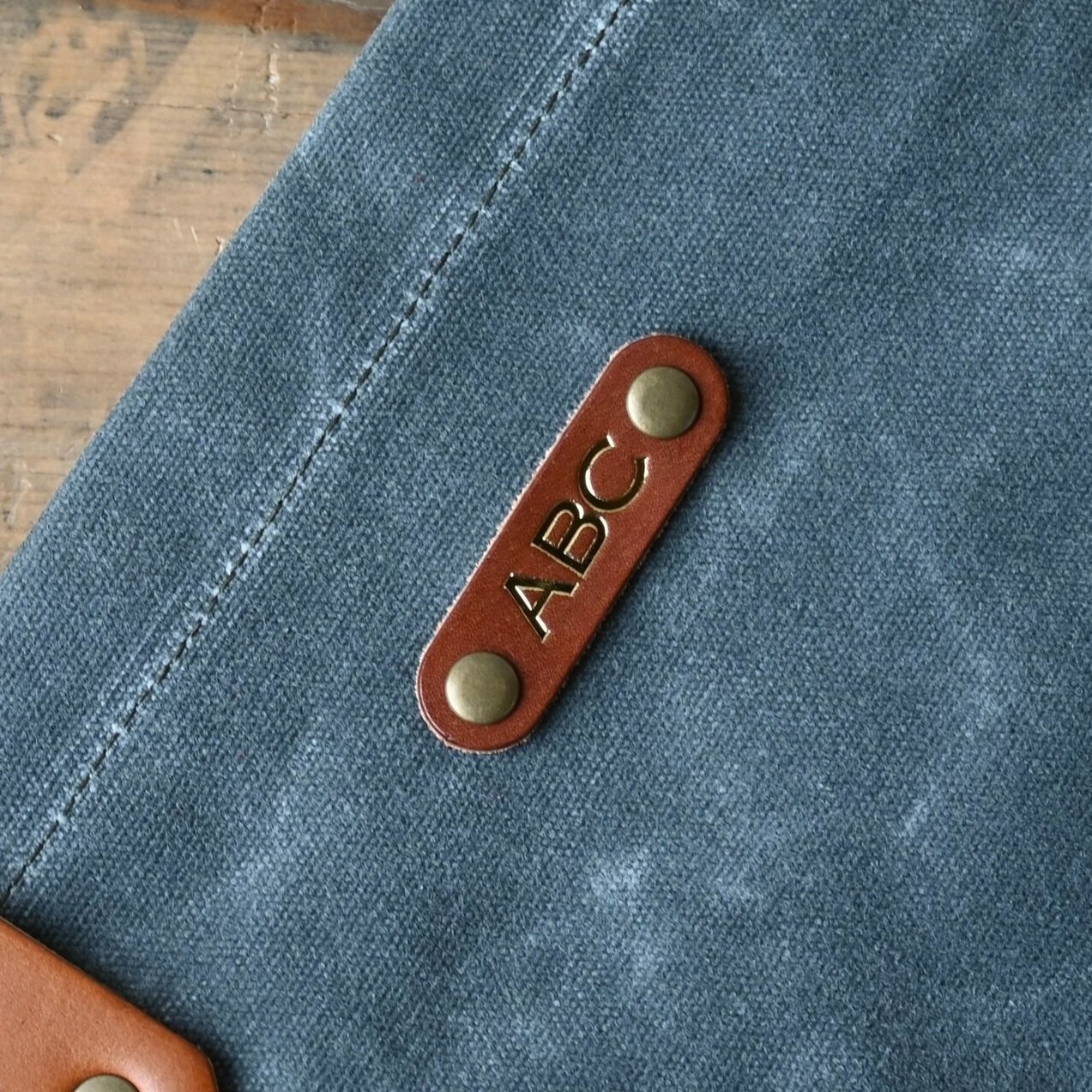 example of our large tab on a bag with foil stamped initials