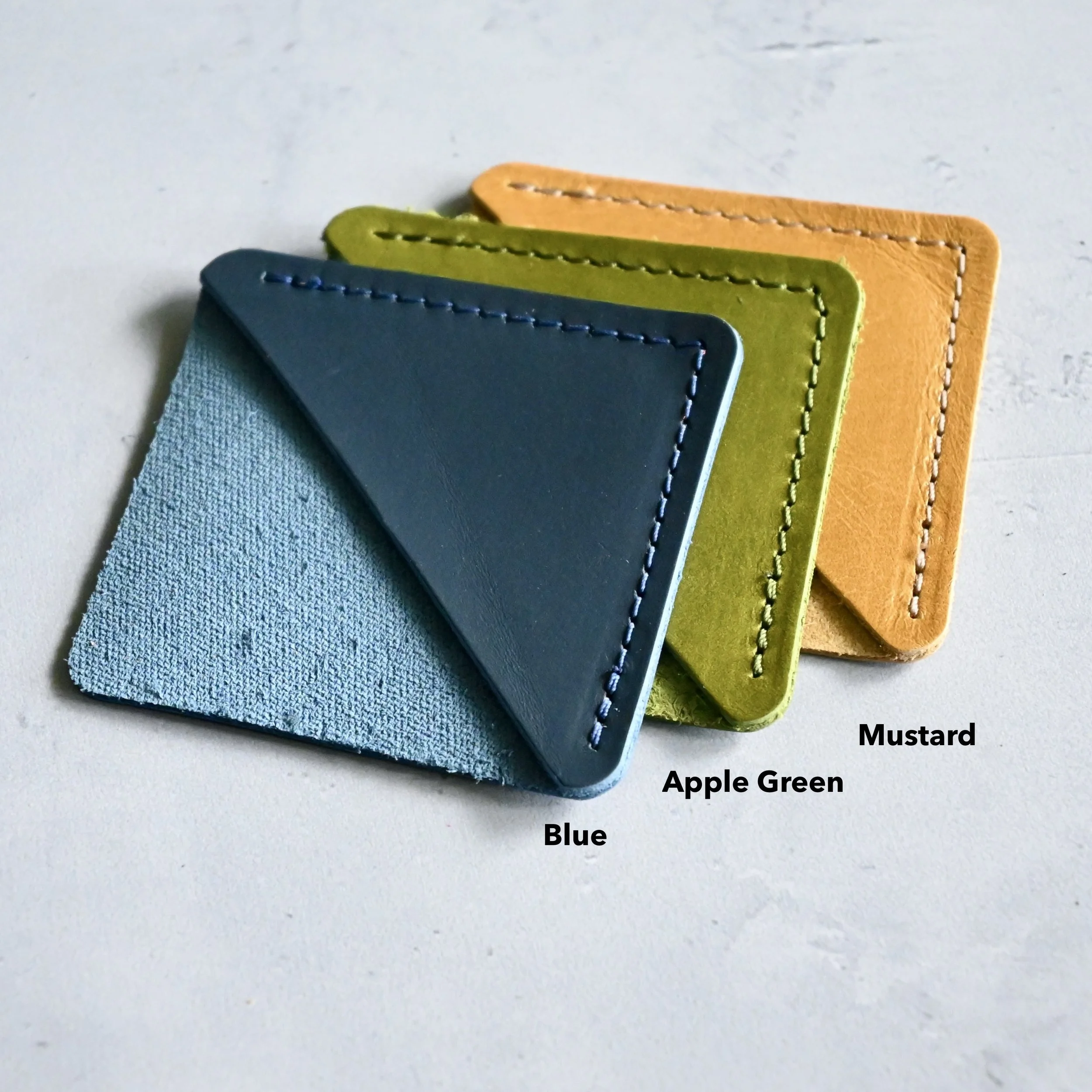 Blue, Green, Mustard Yellow leather corner bookmark.JPG