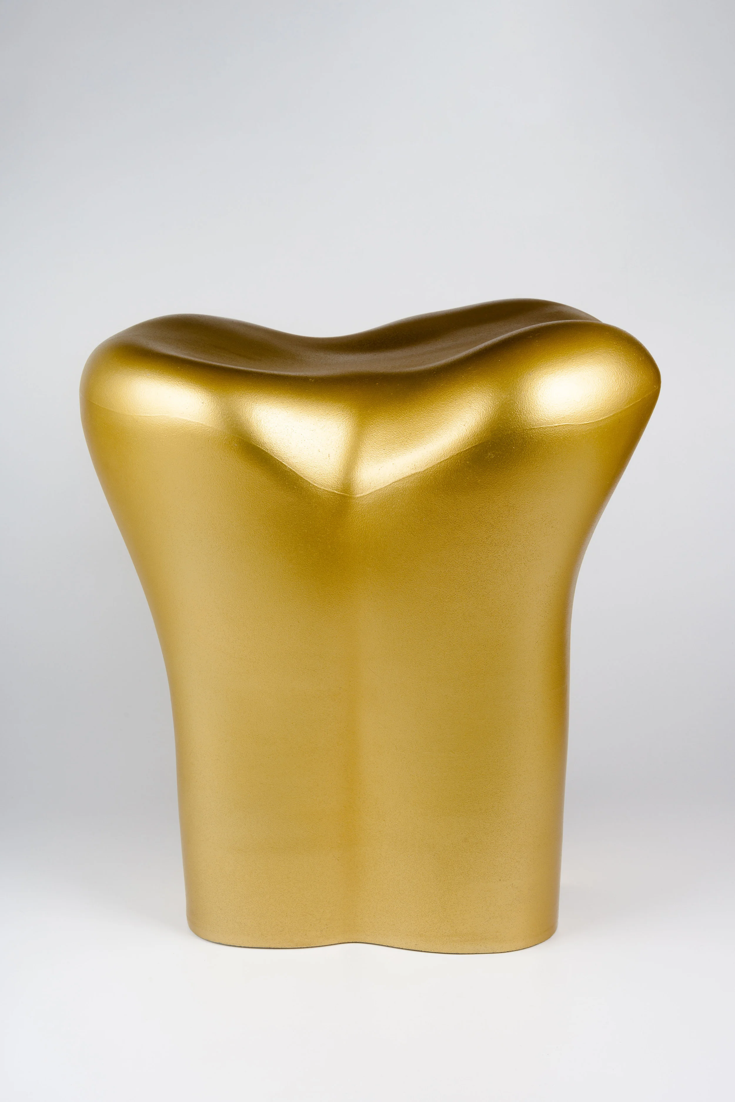 Starck Stool in a shape of a gold tooth