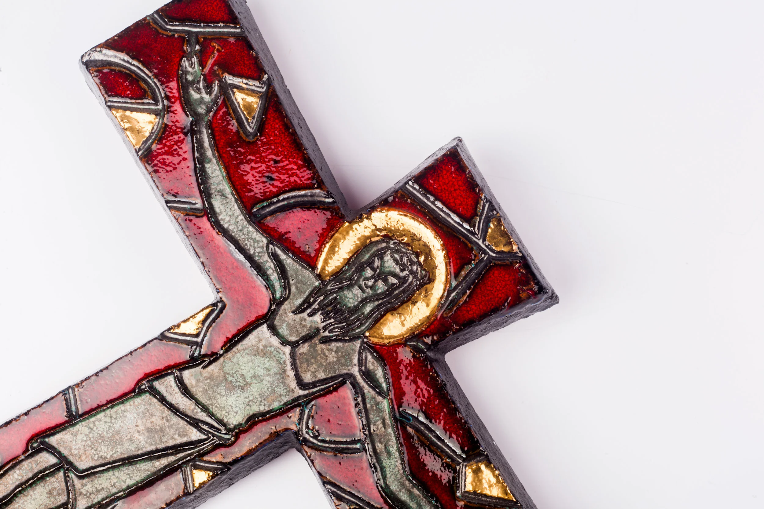 Close up on Jesus in ceramic midcentury crucifix.