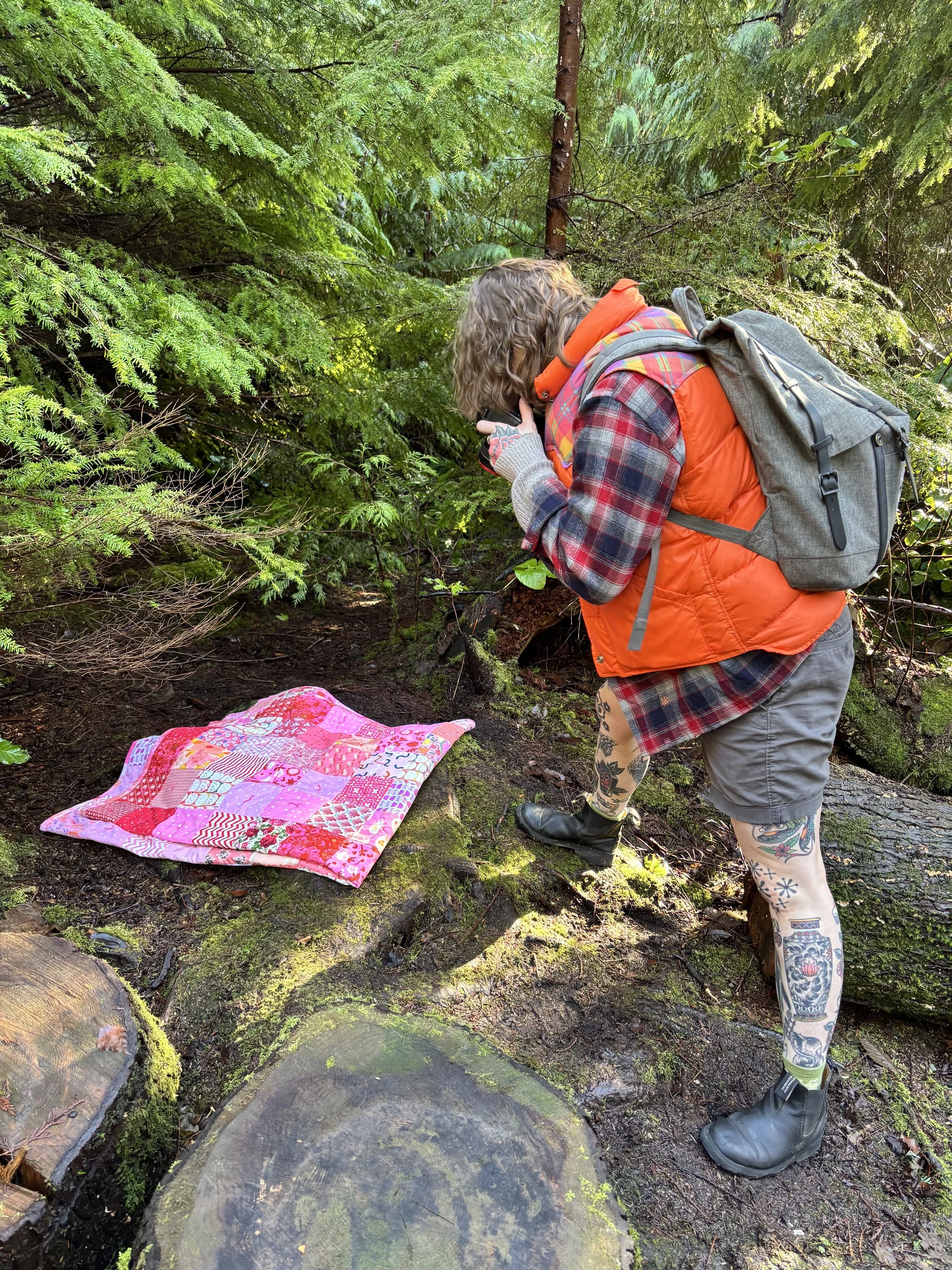taking photos of a quilt in the forest