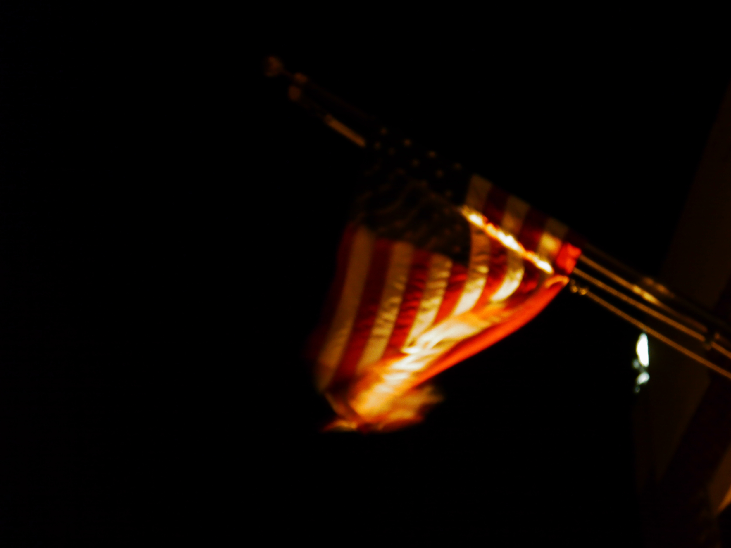 blurry flag in front of firehouse.JPG