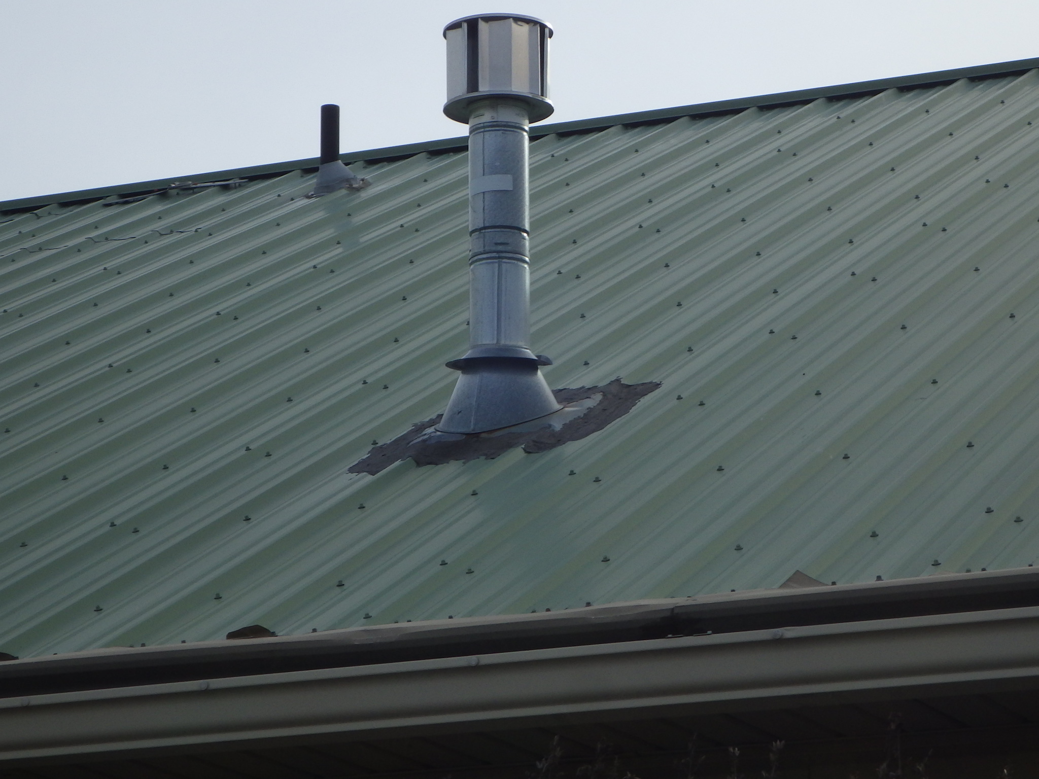 Whoever installed the gas-fired fireplace did NOT understand metal roofing.
