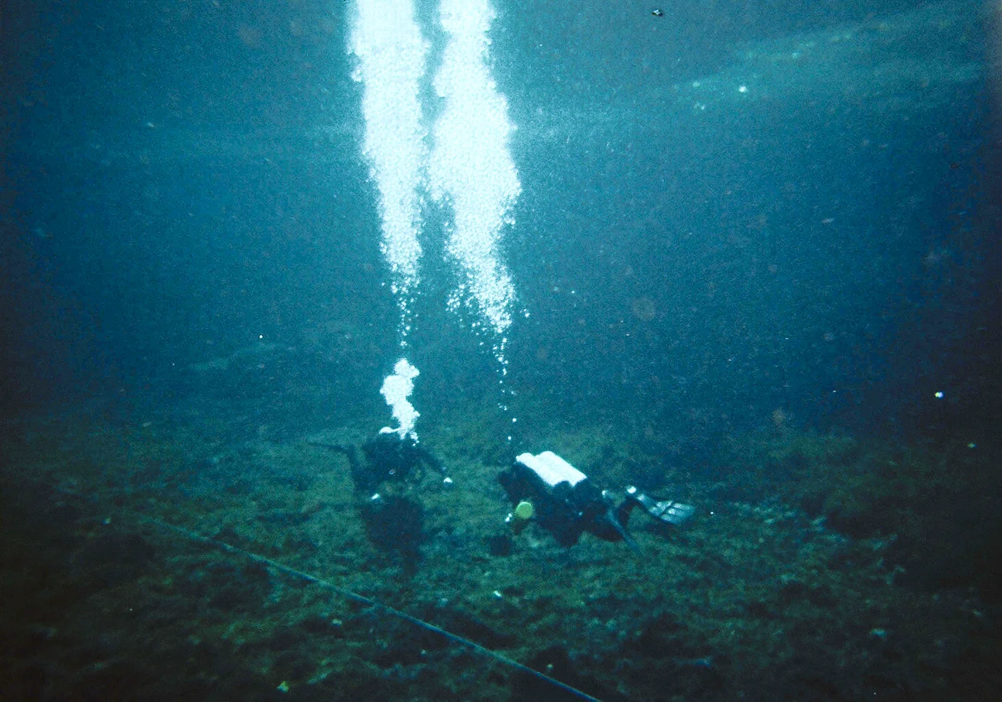 Ucar cenote divers on bottom.jpg
